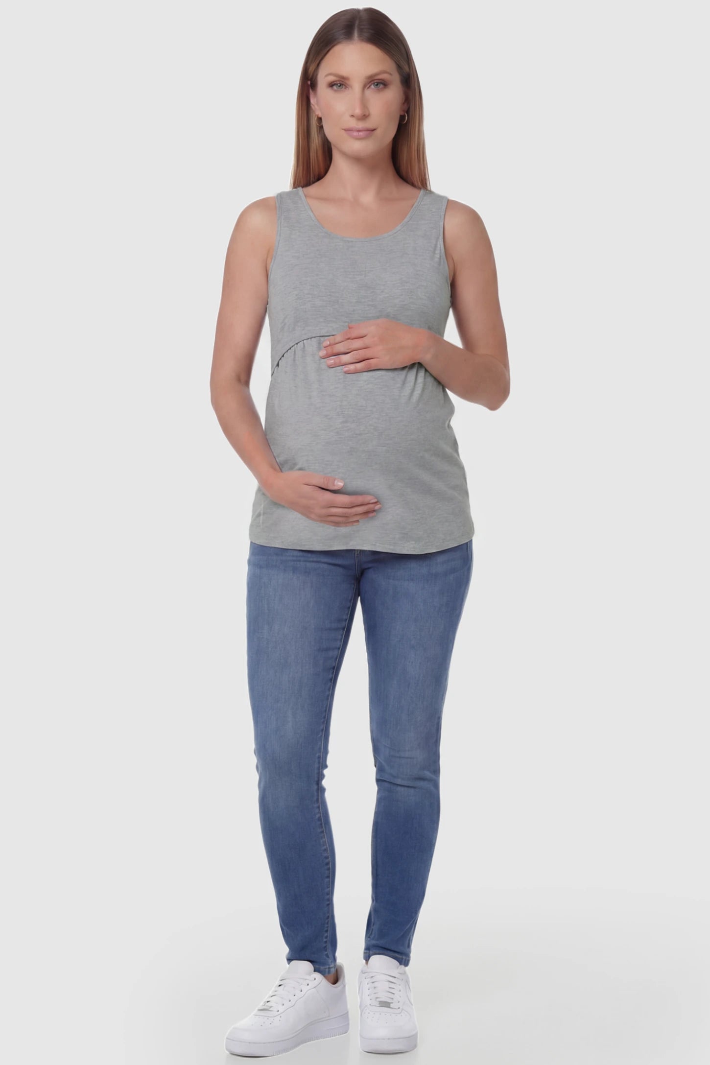 Basic Maternity & Nursing Tank Top Basic Maternity & Nursing Tank Top in gray featuring a scoop neck and smooth, body-hugging fit on a pregnant model, full body view.