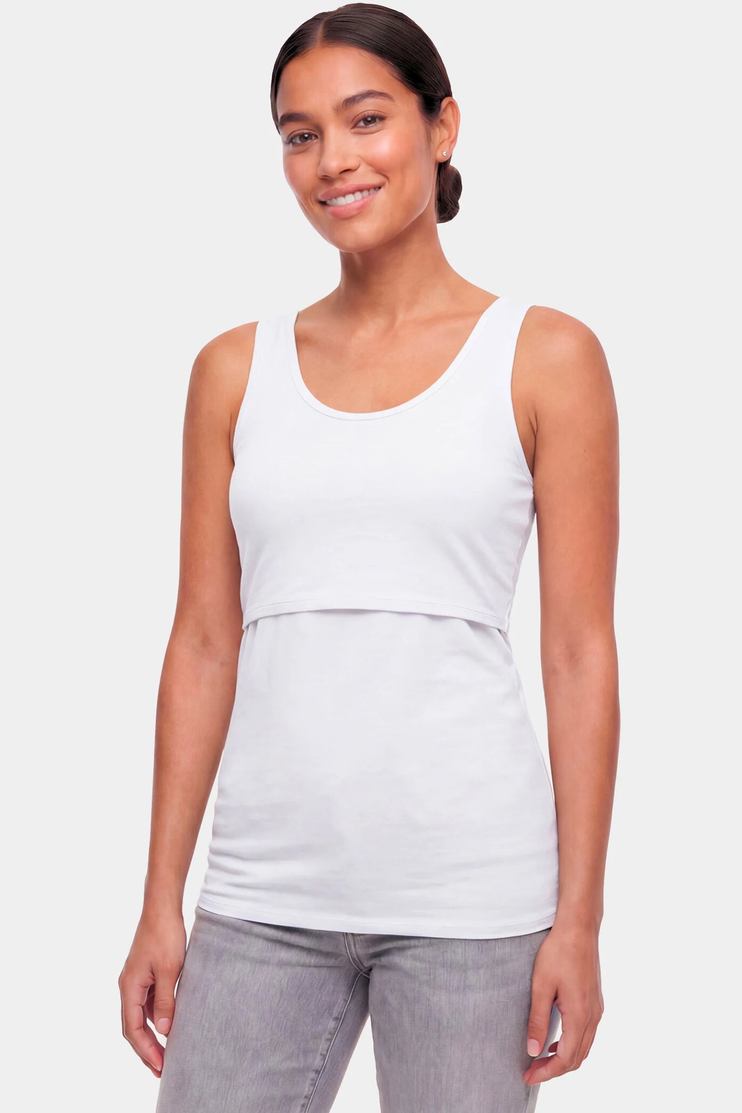 Basic Maternity & Nursing Tank Top Basic Maternity & Nursing Tank Top in white featuring a scoop neck and smooth, body-hugging fit on a non pregnant model.