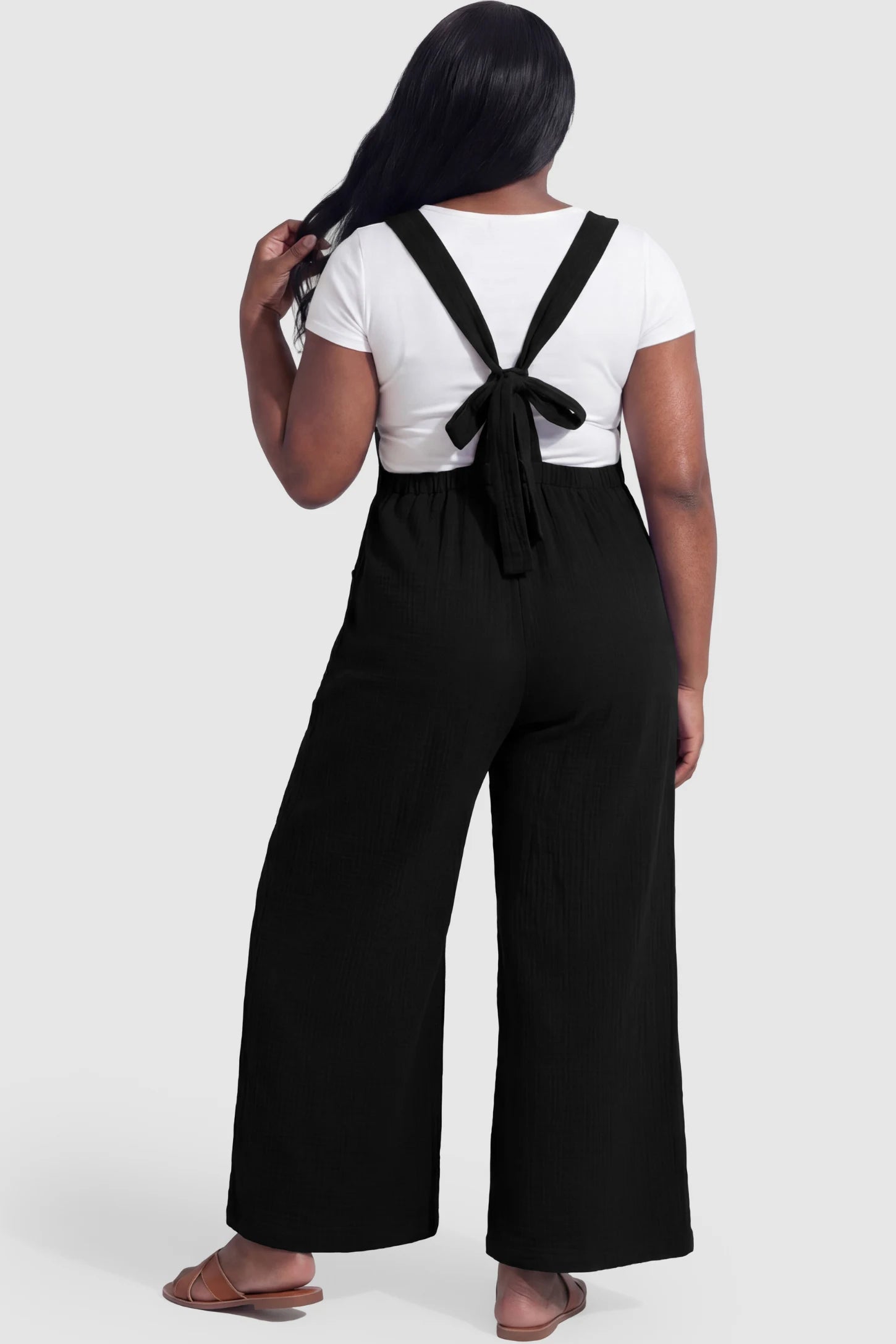 Square Neck Tie-Back Wide Leg Maternity Overalls Square Neck Tie-Back Wide Leg Maternity Overalls in black featuring adjustable tie-back and wide leg silhouette on a pregnant model