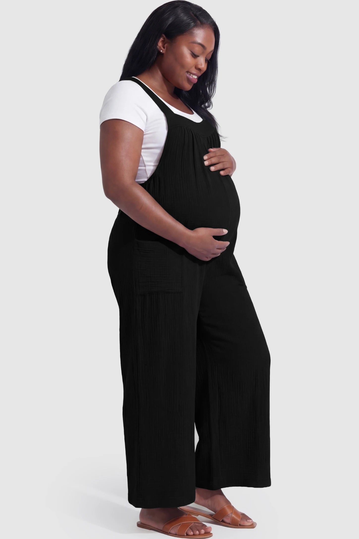 Square Neck Tie-Back Wide Leg Maternity Overalls Square Neck Tie-Back Wide Leg Maternity Overalls in black featuring adjustable tie-back and wide leg silhouette on a pregnant model