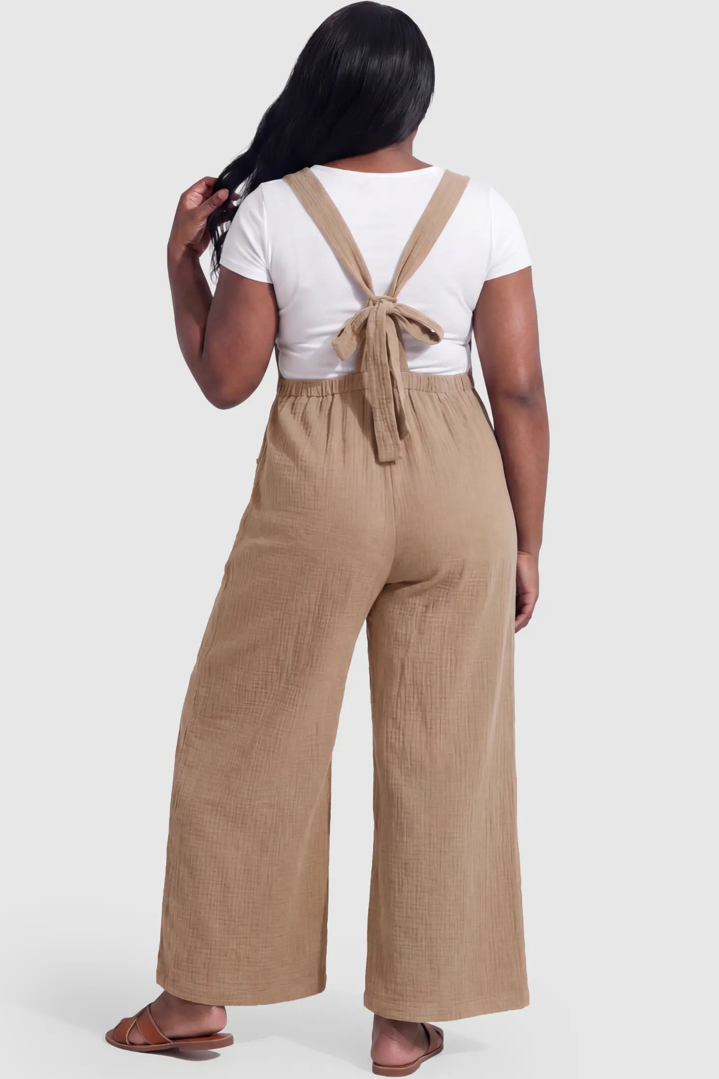 Square Neck Tie-Back Wide Leg Maternity Overalls Square Neck Tie-Back Wide Leg Maternity Overalls in khaki featuring adjustable tie-back and wide leg silhouette on a pregnant model