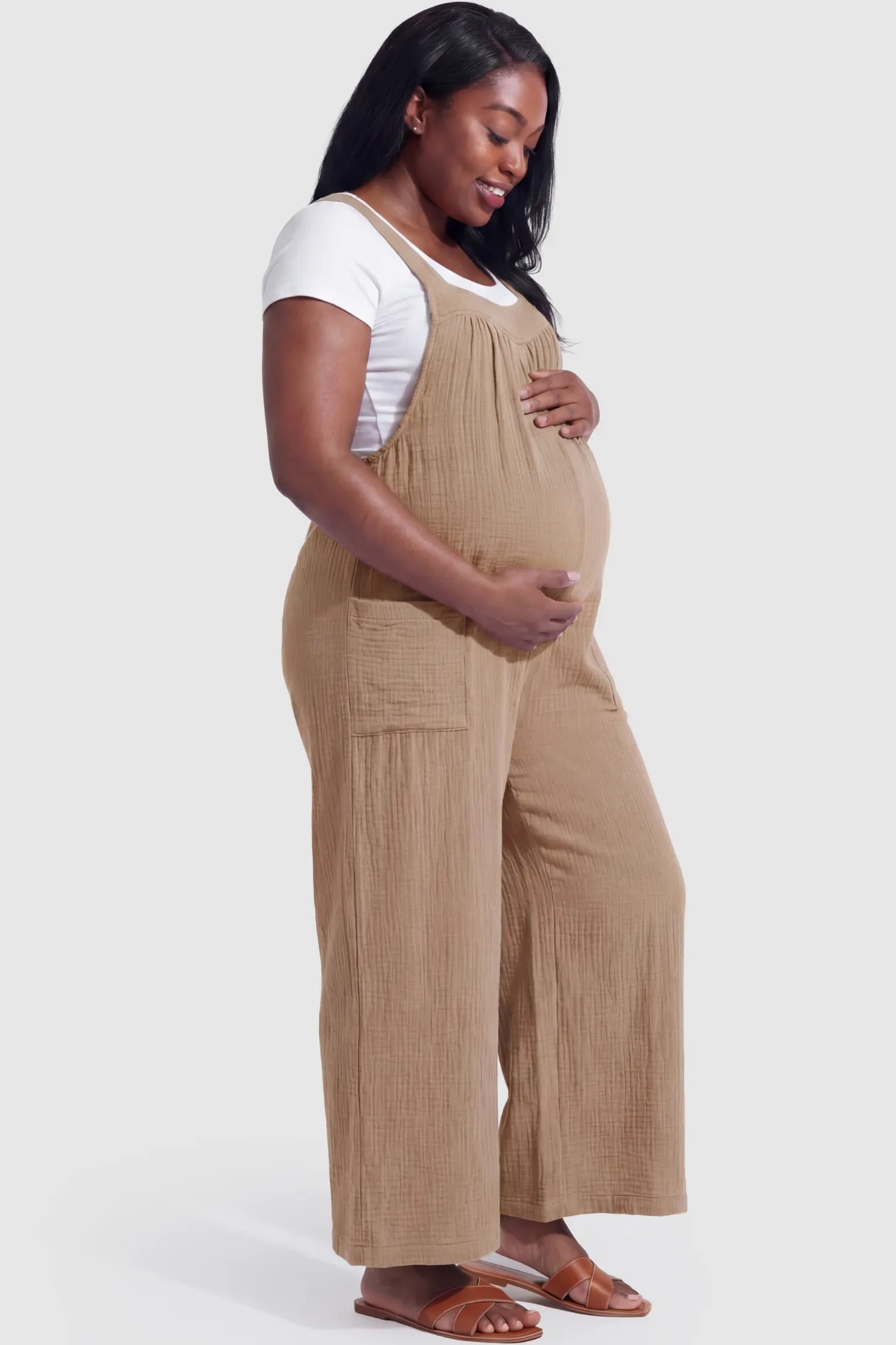Square Neck Tie-Back Wide Leg Maternity Overalls in khaki featuring adjustable tie-back and wide leg silhouette on a pregnant model
