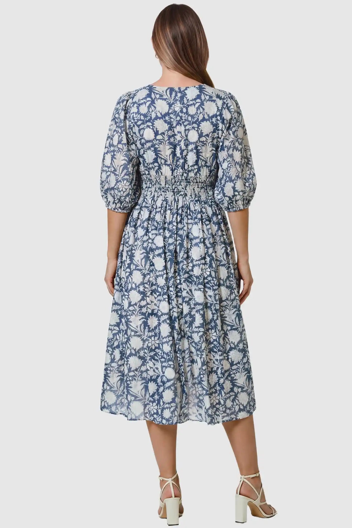 Floral Tie Neck Lantern Sleeve Maternity Midi Dress Floral Tie Neck Lantern Sleeve Maternity Midi Dress in Dark Blue featuring a smocked back detail on a pregnant model.