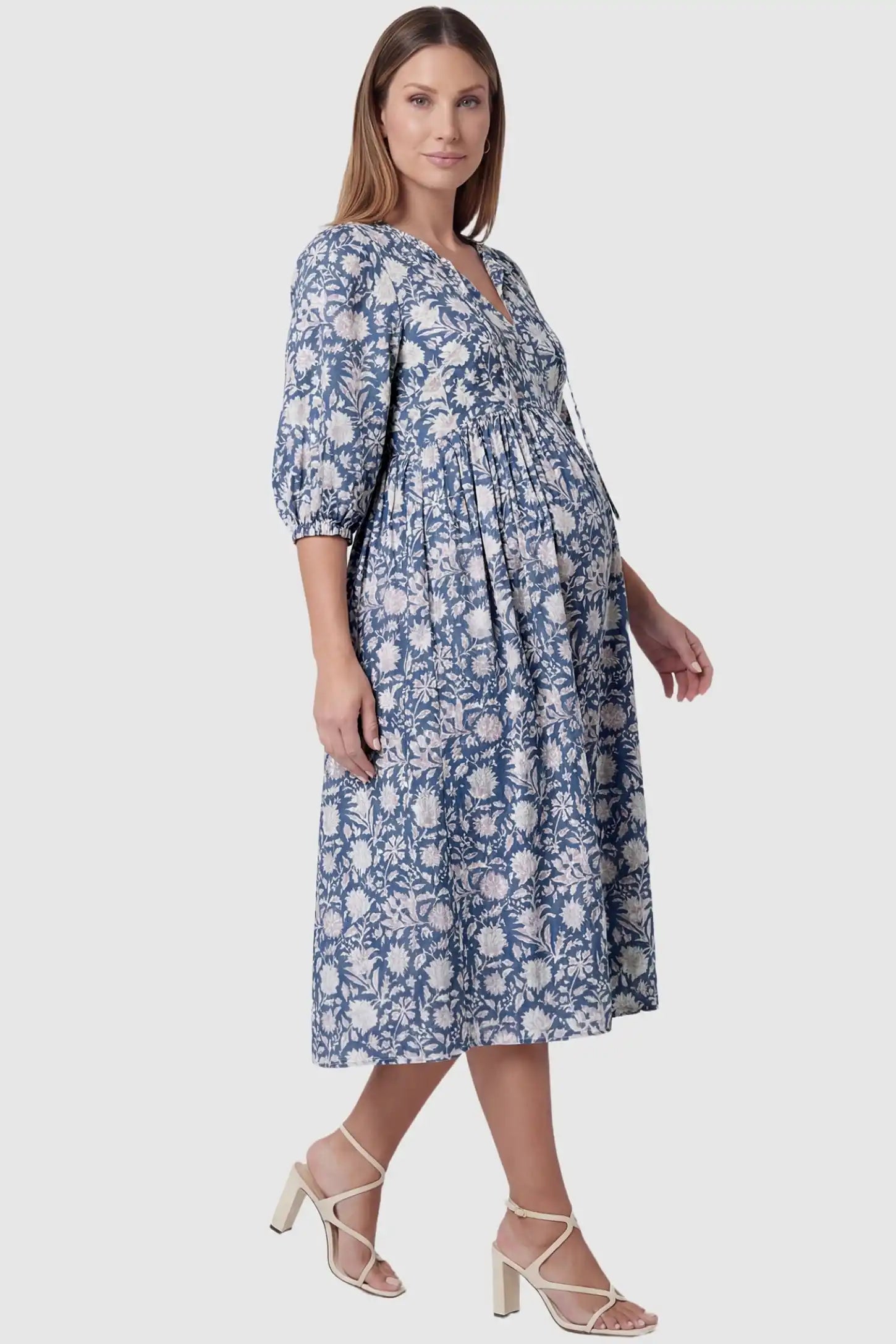 Floral Tie Neck Lantern Sleeve Maternity Midi Dress Floral Tie Neck Lantern Sleeve Maternity Midi Dress in Dark Blue featuring a breezy loose fit on a pregnant model.