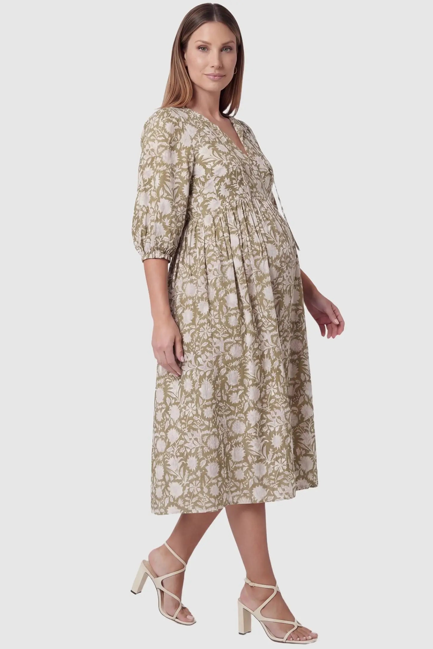 Floral Tie Neck Lantern Sleeve Maternity Midi Dress in Olive Green featuring a breezy loose fit on a pregnant model.