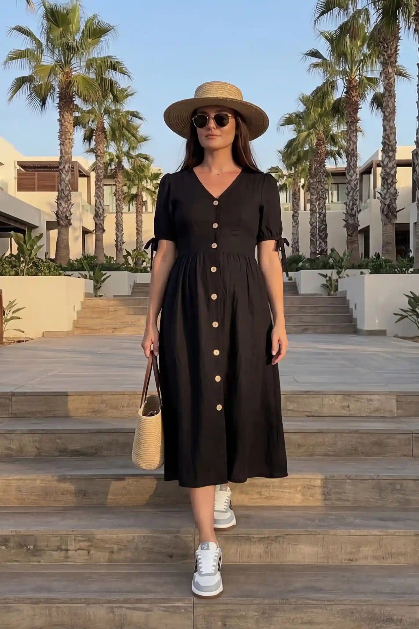 Tie-Sleeve V-Neck Flared Maternity Midi Dress Editorial view Tie-Sleeve V-Neck Flared Maternity Midi Dress in Black featuring tie-sleeves on a pregnant model.