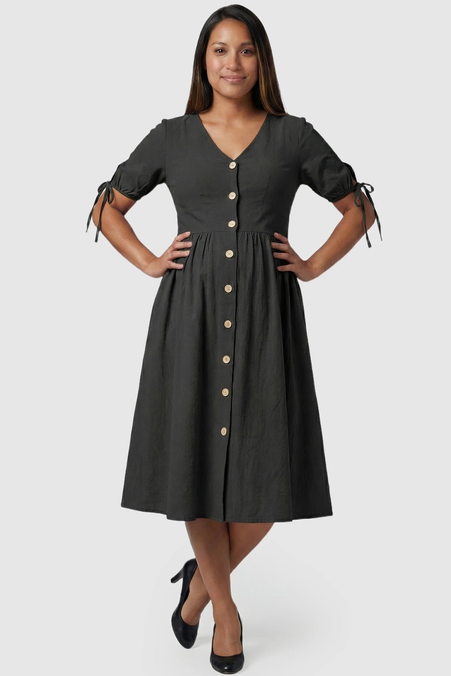 Tie-Sleeve V-Neck Flared Maternity Midi Dress Tie-Sleeve V-Neck Flared Maternity Midi Dress in Black featuring functional buttons on a pregnant model.