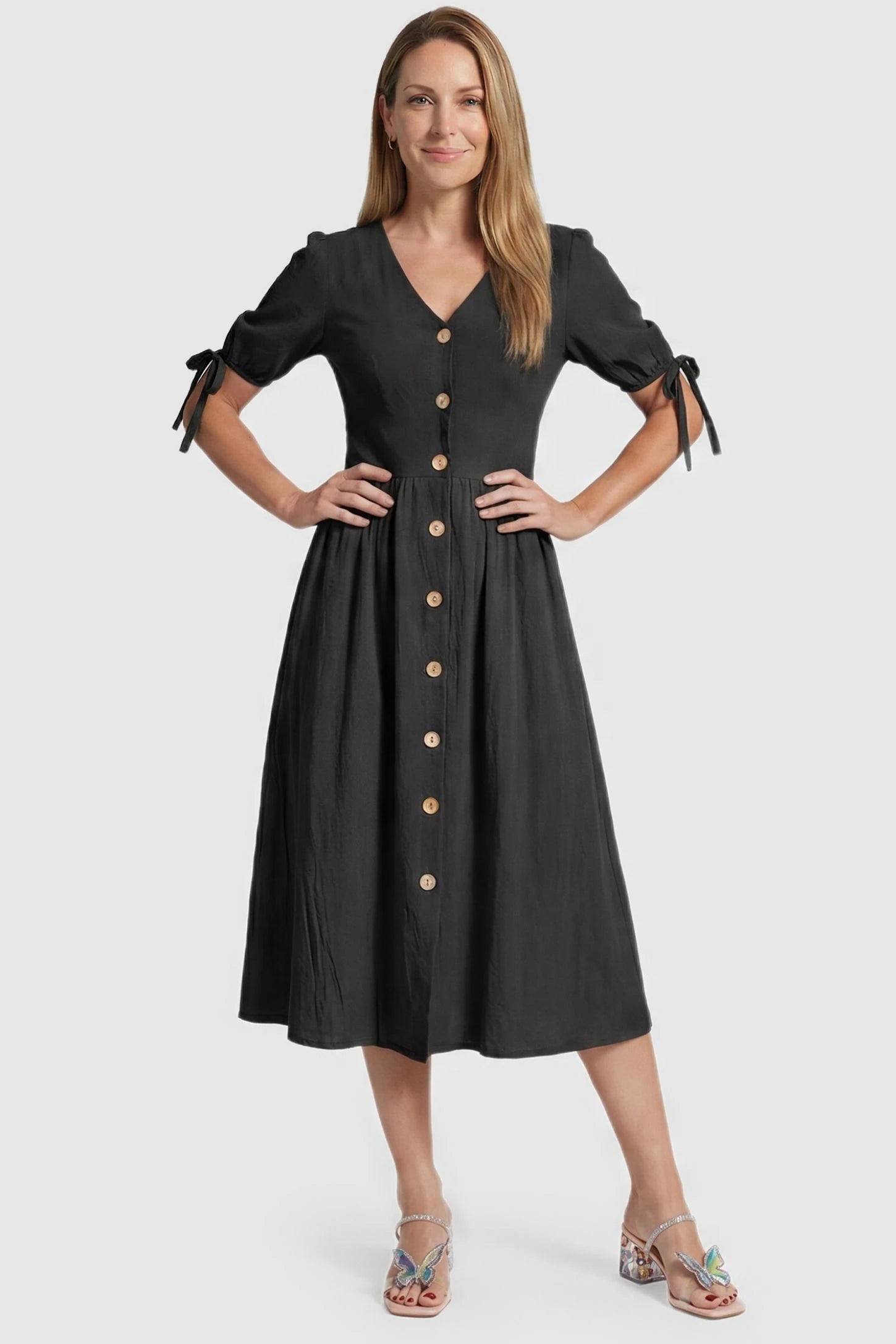 Tie-Sleeve V-Neck Flared Maternity Midi Dress Postpartum view Tie-Sleeve V-Neck Flared Maternity Midi Dress in Black featuring a button front on a non-pregnant model.