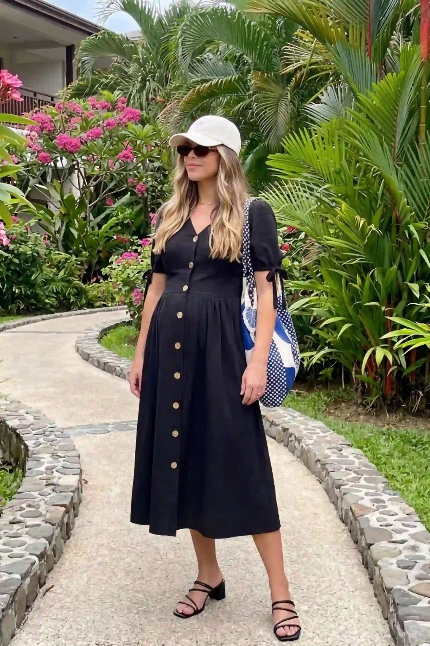 Tie-Sleeve V-Neck Flared Maternity Midi Dress UGC view Tie-Sleeve V-Neck Flared Maternity Midi Dress in Black featuring a v-neckline on a non-pregnant model.
