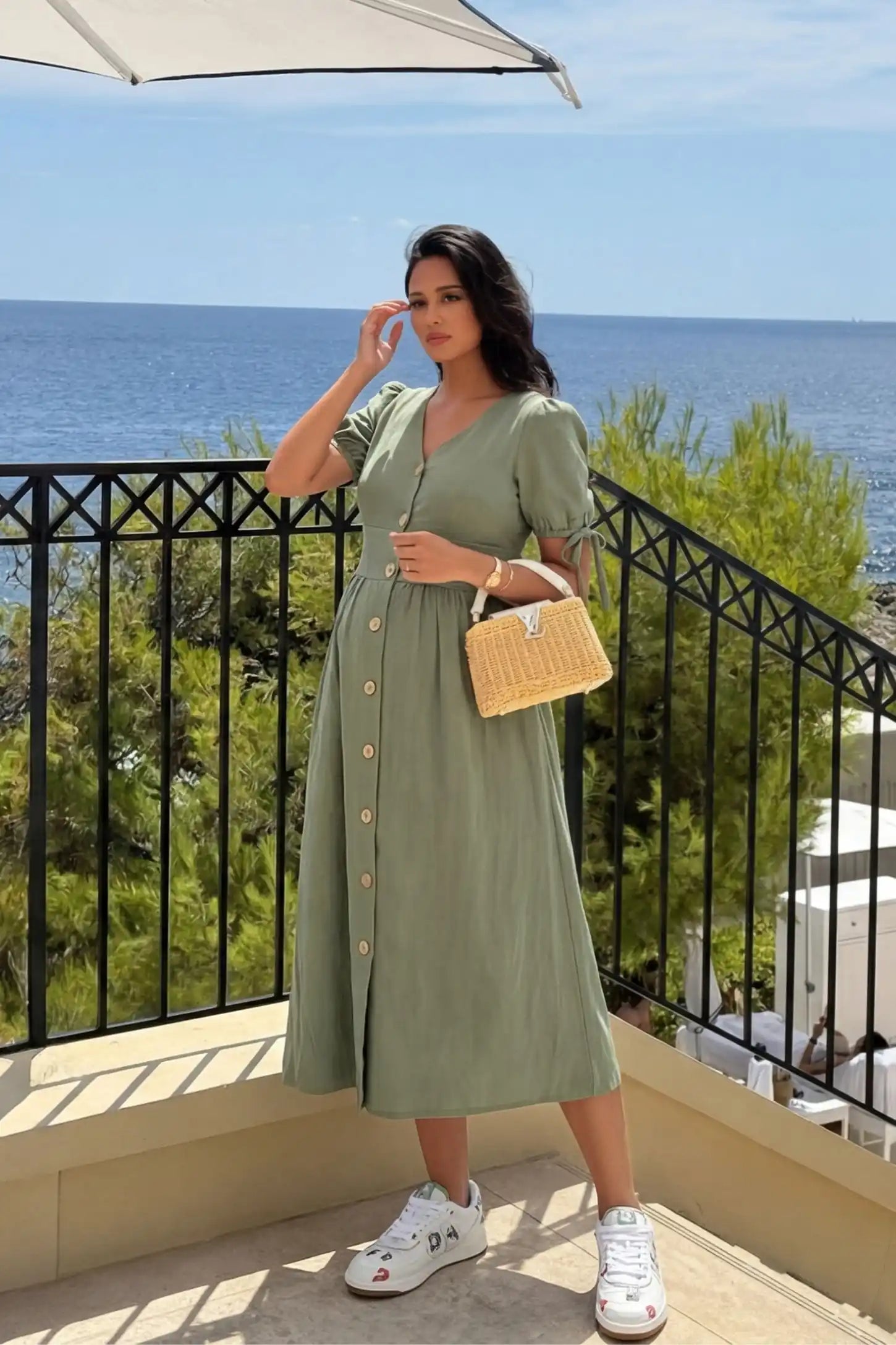Tie-Sleeve V-Neck Flared Maternity Midi Dress Editorial view Tie-Sleeve V-Neck Flared Maternity Midi Dress in Green featuring tie-sleeves on a pregnant model.