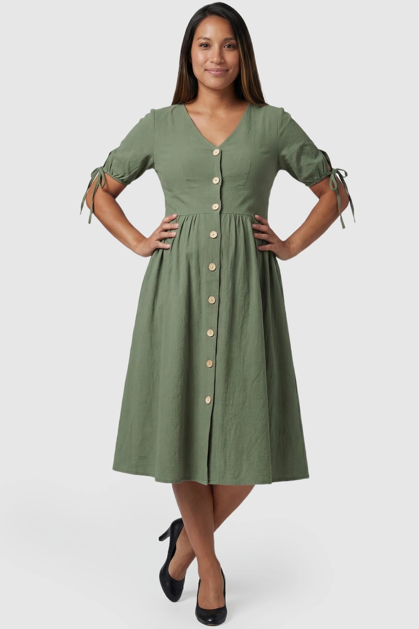 Tie-Sleeve V-Neck Flared Maternity Midi Dress Tie-Sleeve V-Neck Flared Maternity Midi Dress in Green featuring button splicing on a pregnant model.