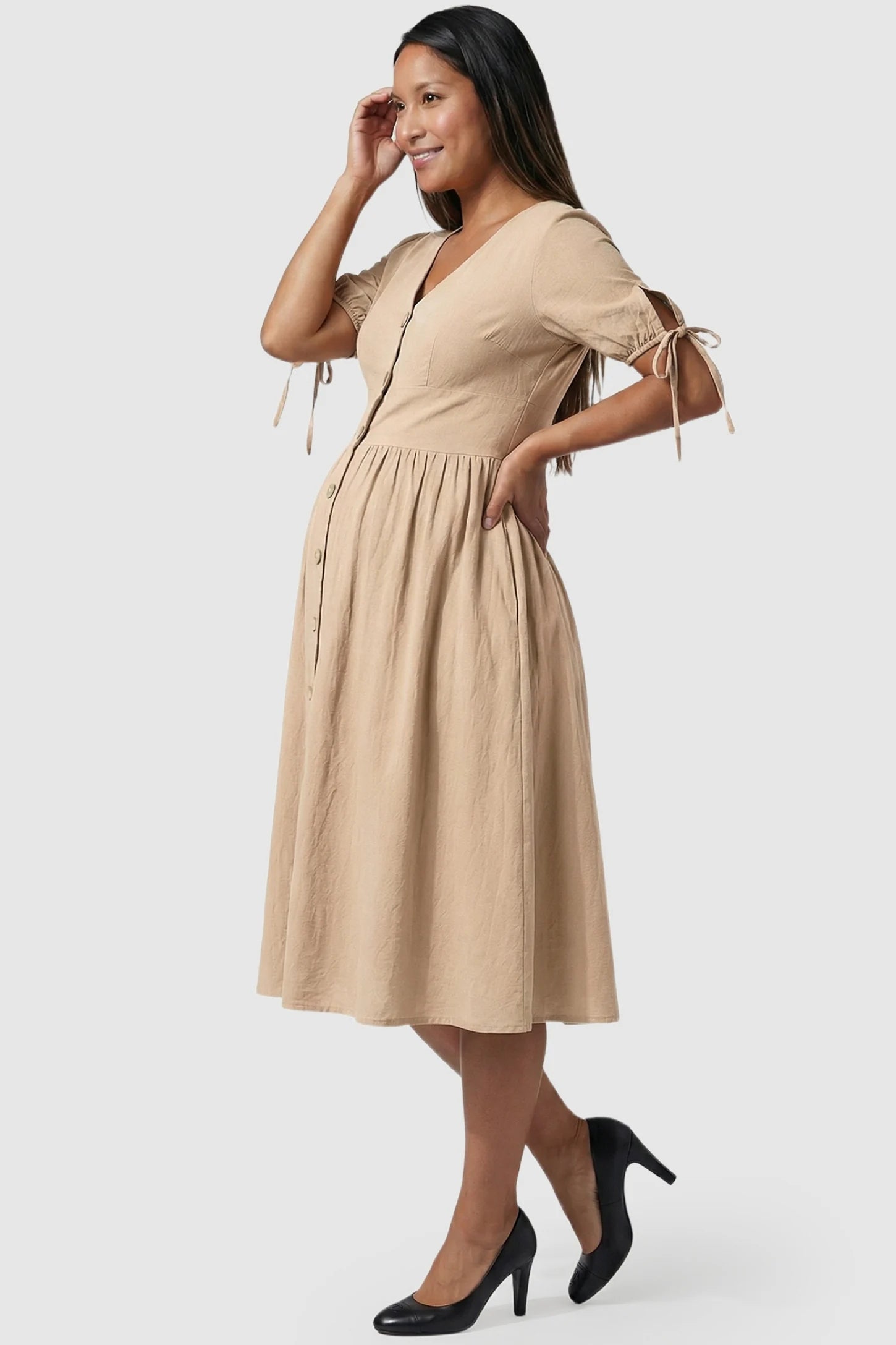 Tie-Sleeve V-Neck Flared Maternity Midi Dress in Apricot showing the high-waisted A-line profile on a pregnant model.