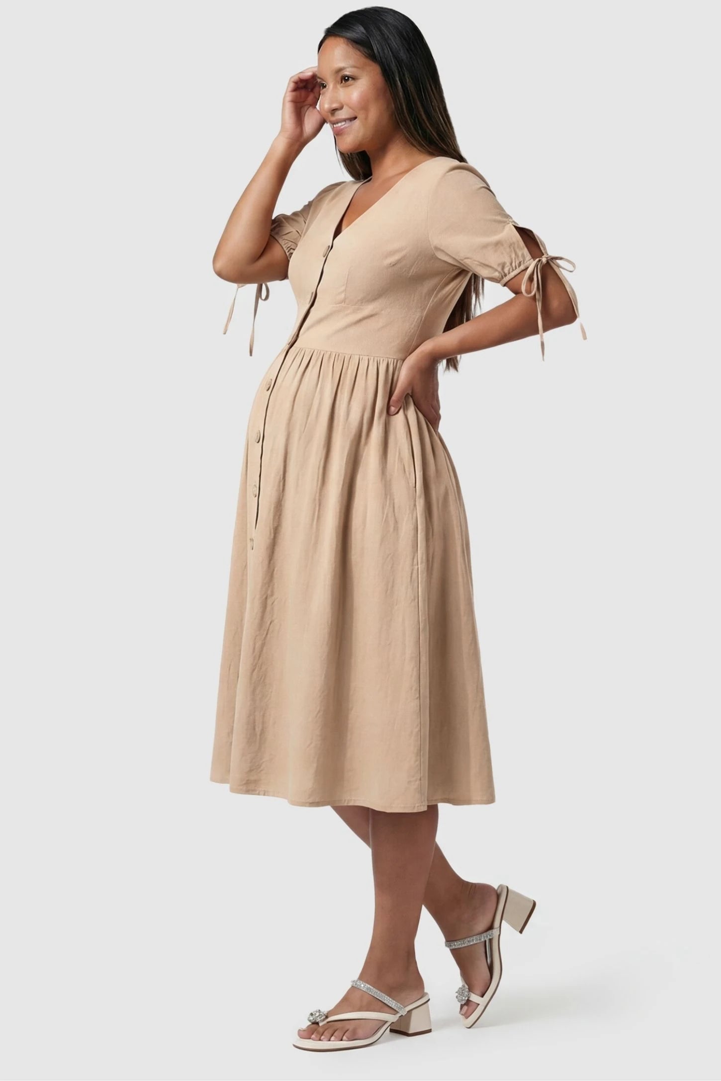Tie-Sleeve V-Neck Flared Maternity Midi Dress Back view Tie-Sleeve V-Neck Flared Maternity Midi Dress in Apricot featuring a flared skirt on a non-pregnant model.