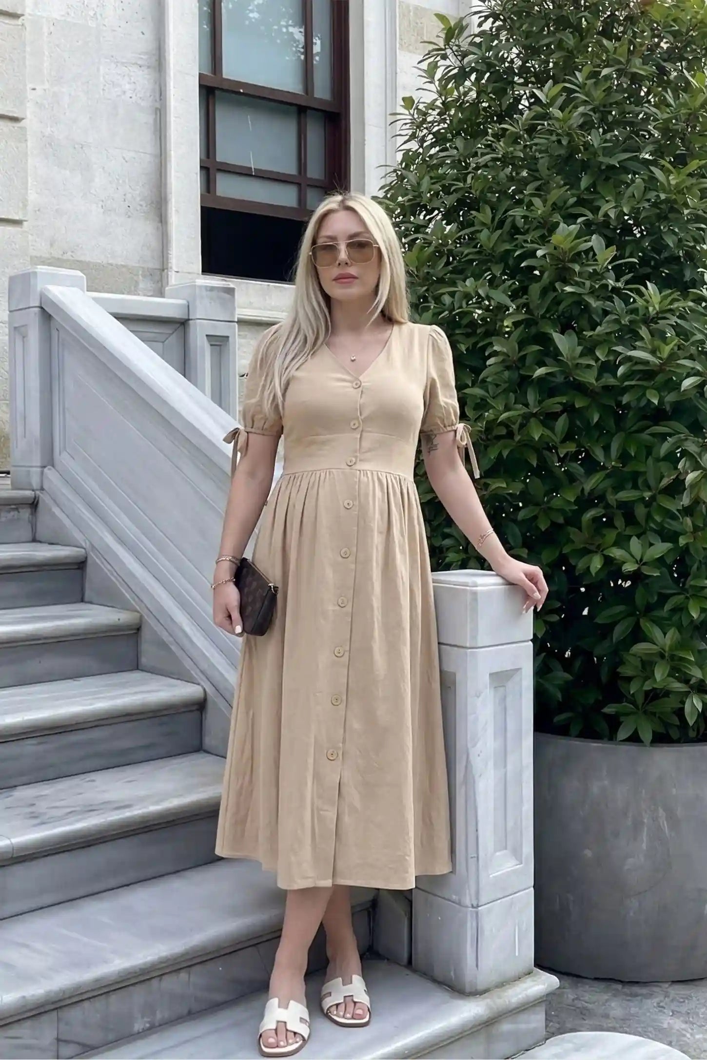 Tie-Sleeve V-Neck Flared Maternity Midi Dress UGC view Tie-Sleeve V-Neck Flared Maternity Midi Dress in Apricot featuring a v-neckline on a non-pregnant model.