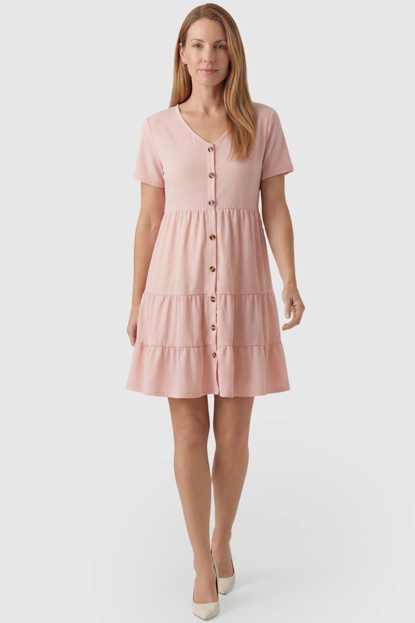 Tiered Button-Front A-Line Maternity Summer Dress Tiered Button-Front A-Line Maternity Summer Dress in Pink featuring a loose, adaptive fit on a non-pregnant model.