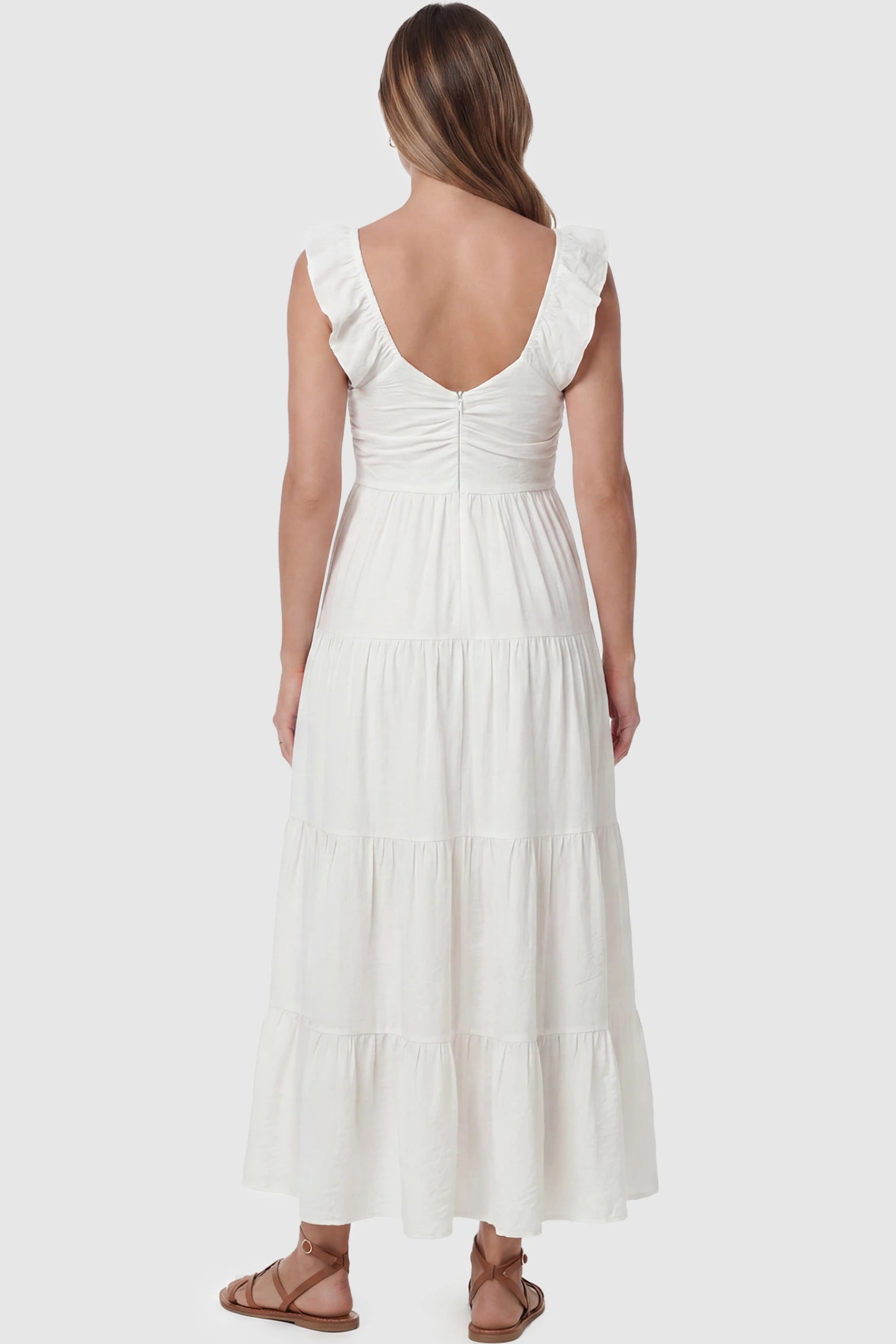 Ruffled Sleeve V-neck A-line Maternity Midi Dress Ruffled sleeve V-neck A-line maternity midi dress in off-white with ruffled sleeves and tiered skirt, back view on pregnant model