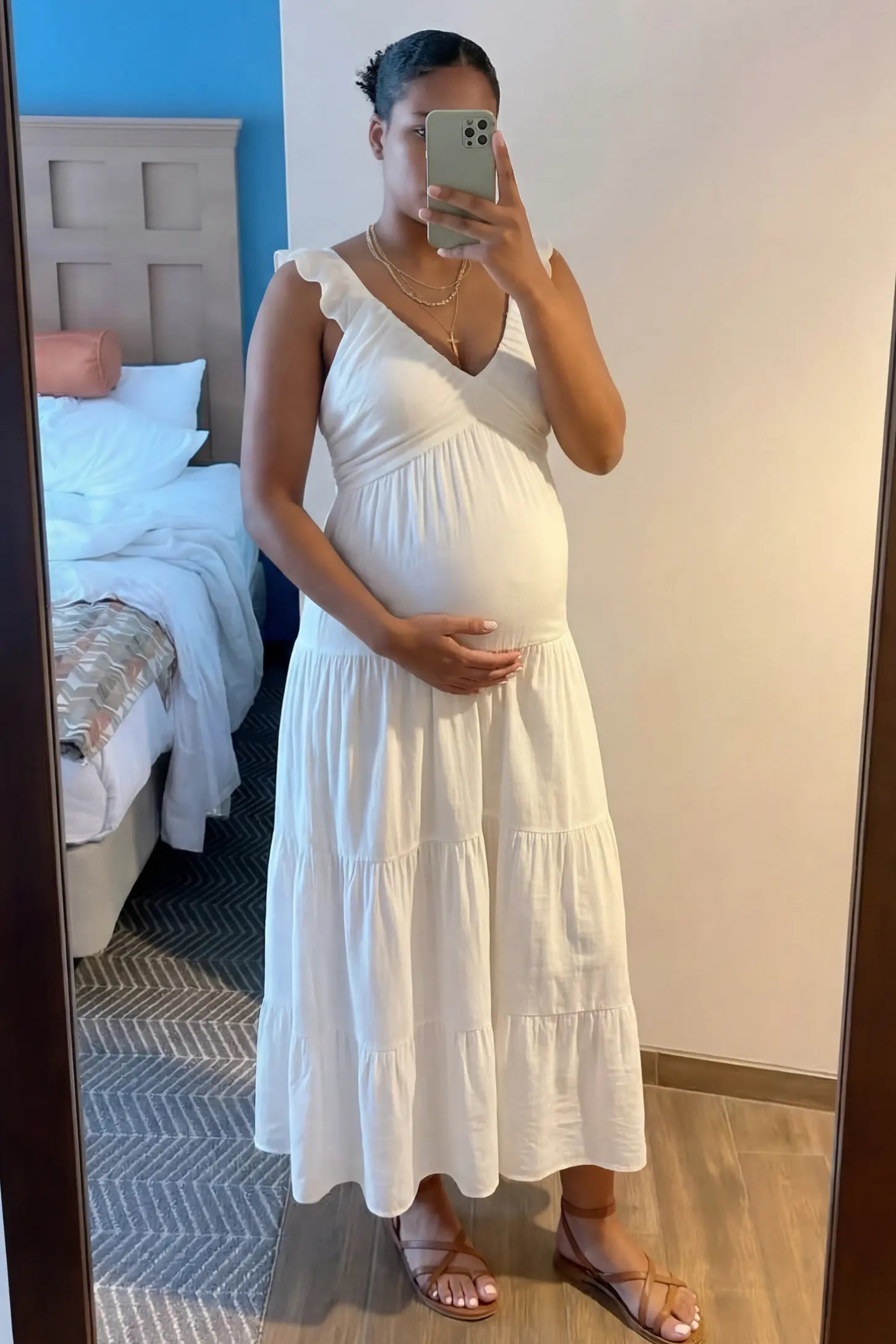 Ruffled Sleeve V-neck A-line Maternity Midi Dress Ruffled sleeve V-neck A-line maternity midi dress in off-white with V-neckline and ruffled sleeves, front view on pregnant model