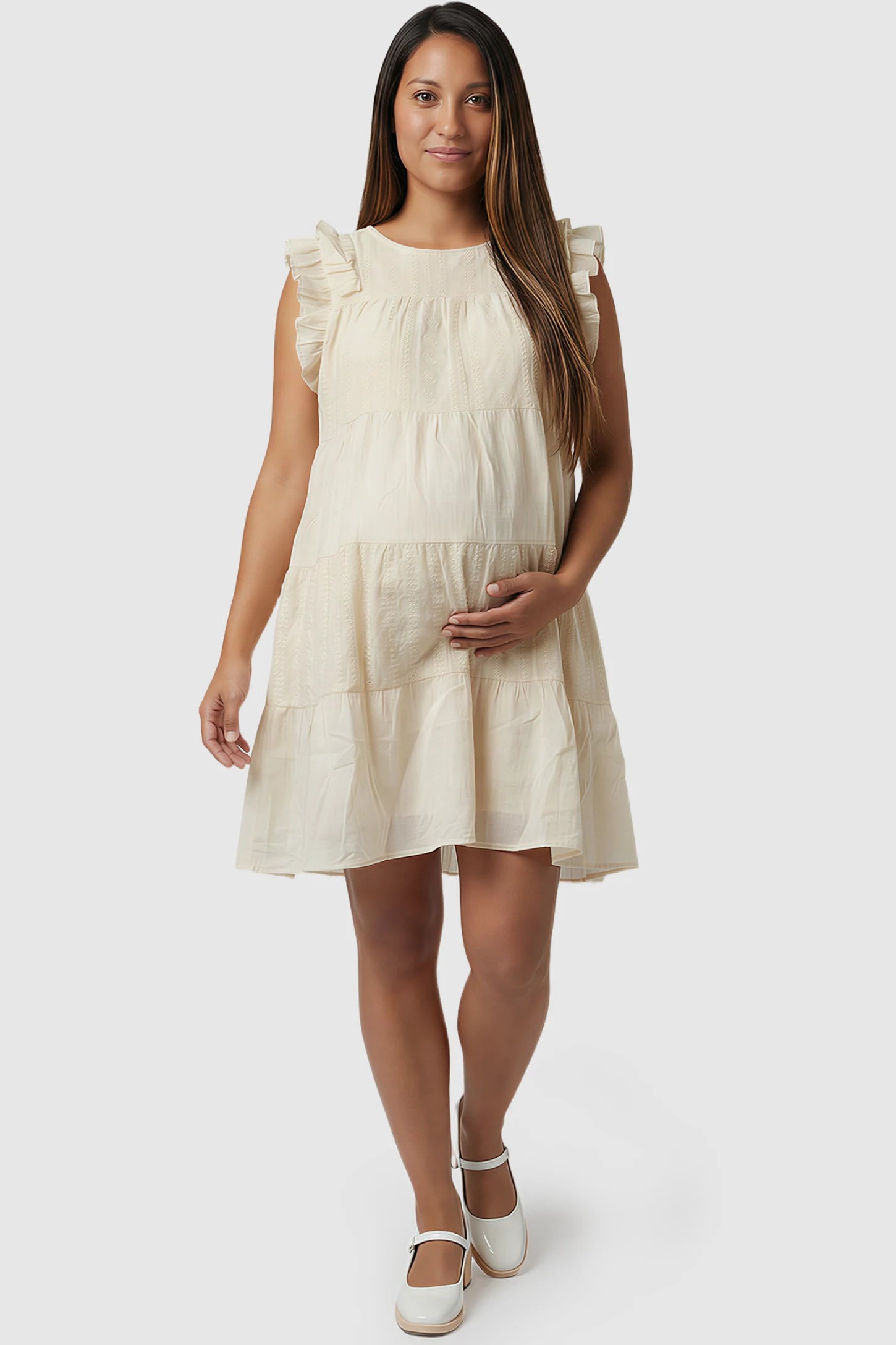 Crochet Detail Round Neck Tiered Maternity Short Dress Crochet detail round neck tiered maternity short dress in pale yellow with tiered & ruffle sleeve design, front view on pregnant model