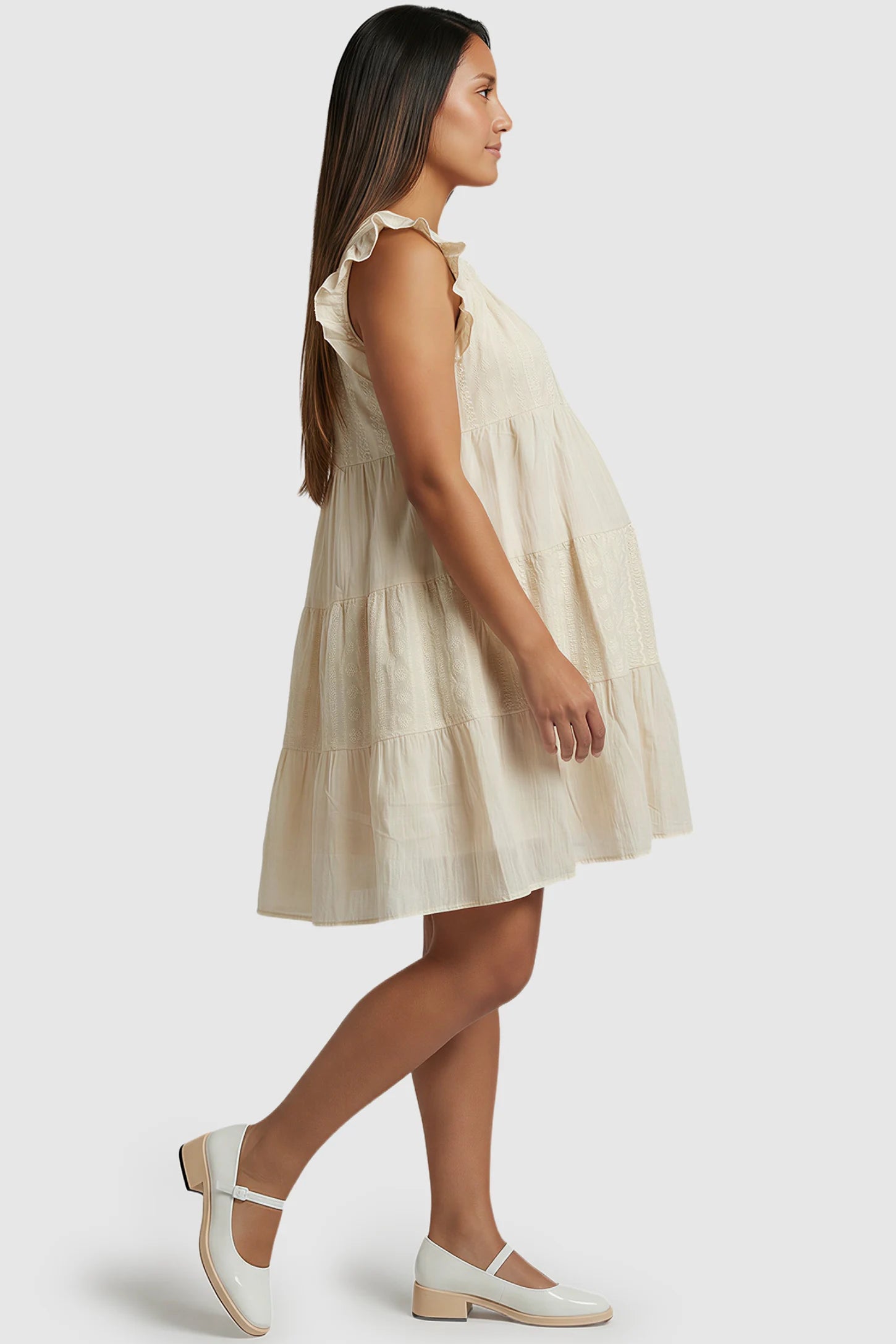 Crochet Detail Round Neck Tiered Maternity Short Dress Crochet detail round neck tiered maternity short dress in pale yellow with tiered & ruffle sleeve design, side view on pregnant model
