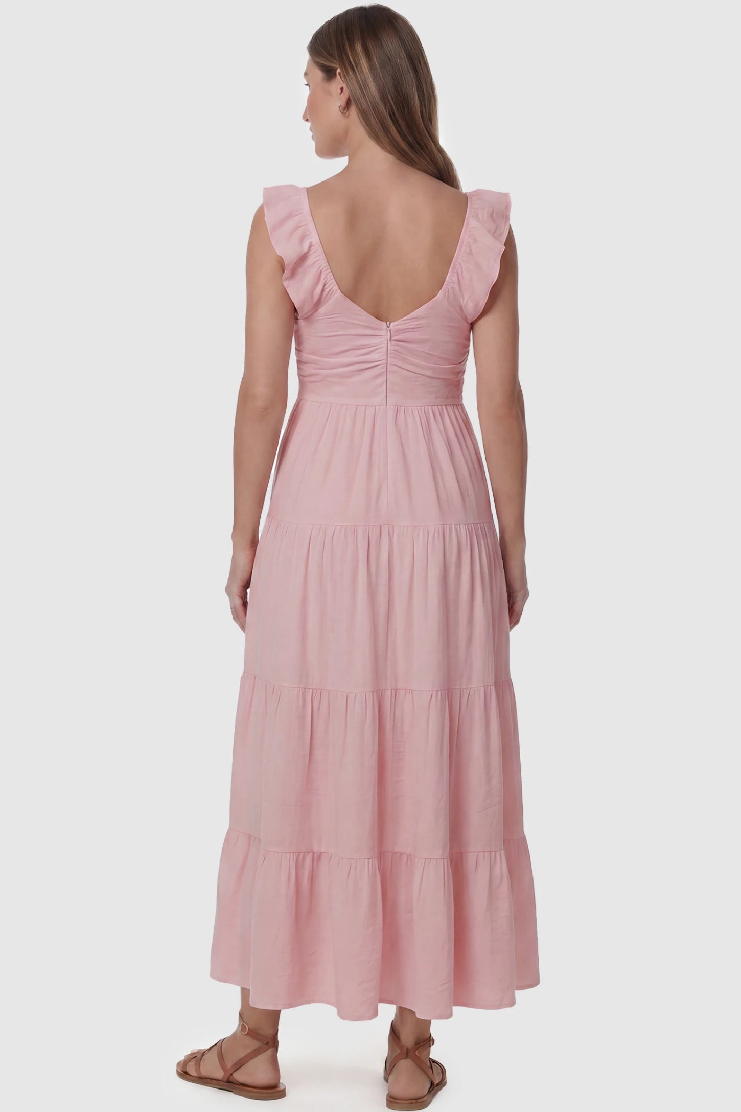 Ruffled Sleeve V-neck A-line Maternity Midi Dress Ruffled sleeve V-neck A-line maternity midi dress in pink with ruffled sleeves and tiered skirt, back view on pregnant model