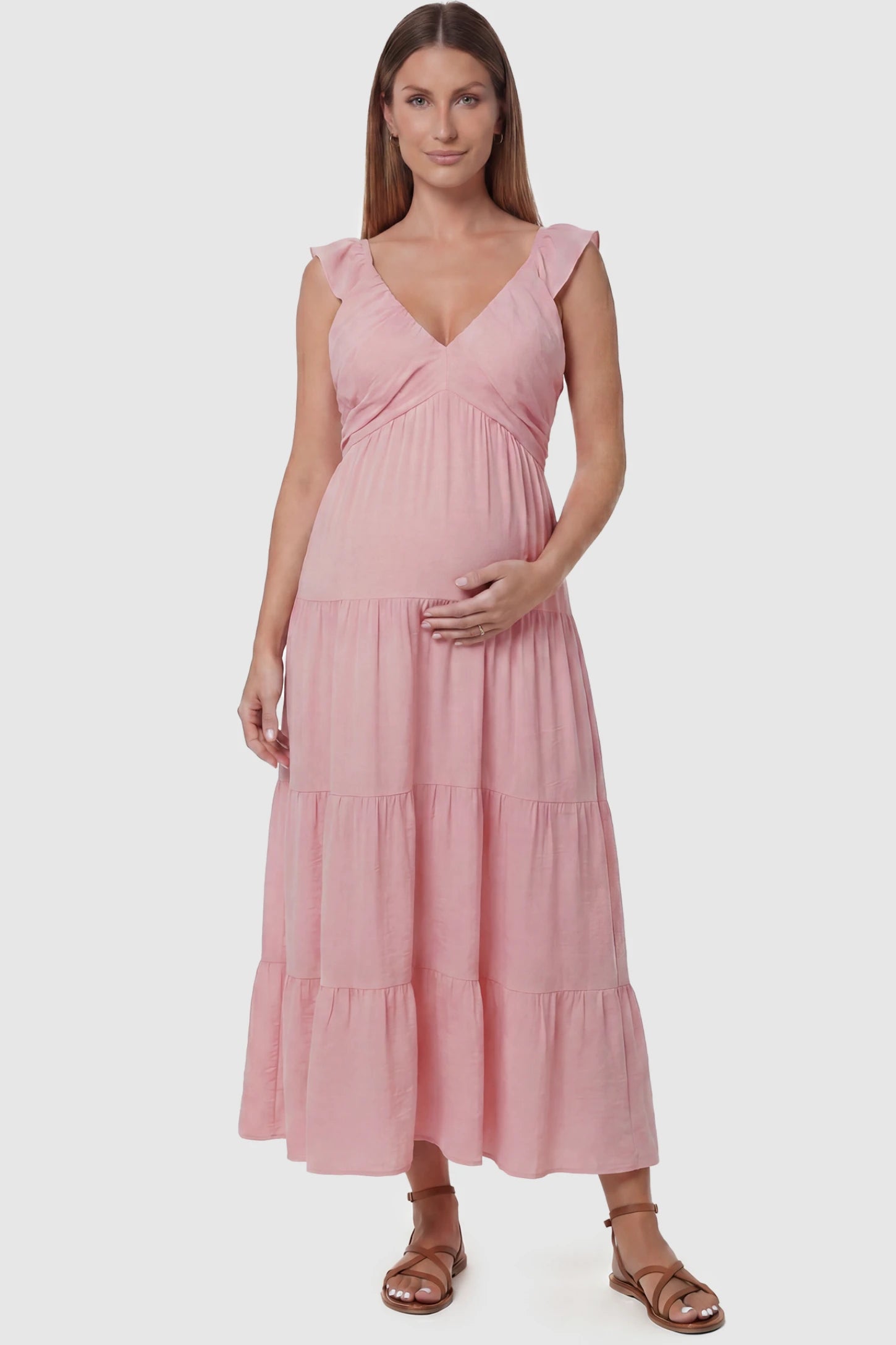 Ruffled Sleeve V-neck A-line Maternity Midi Dress Ruffled sleeve V-neck A-line maternity midi dress in pink with V-neckline and ruffled sleeves, front view on pregnant model