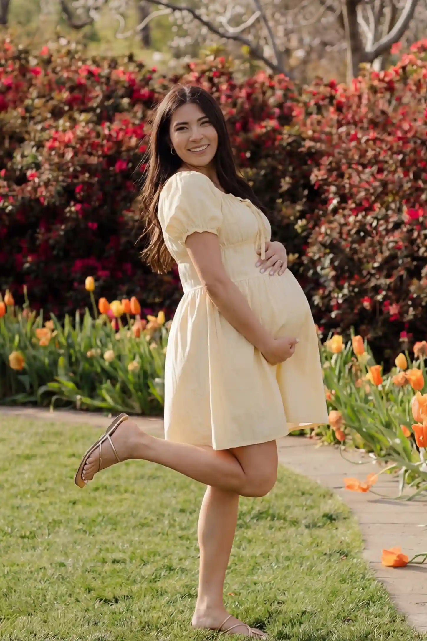 Short Sleeve Tiered A-Line Maternity Short Dress Short sleeve tiered A-line maternity short dress in yellow with elegant short sleeves, side view on pregnant model