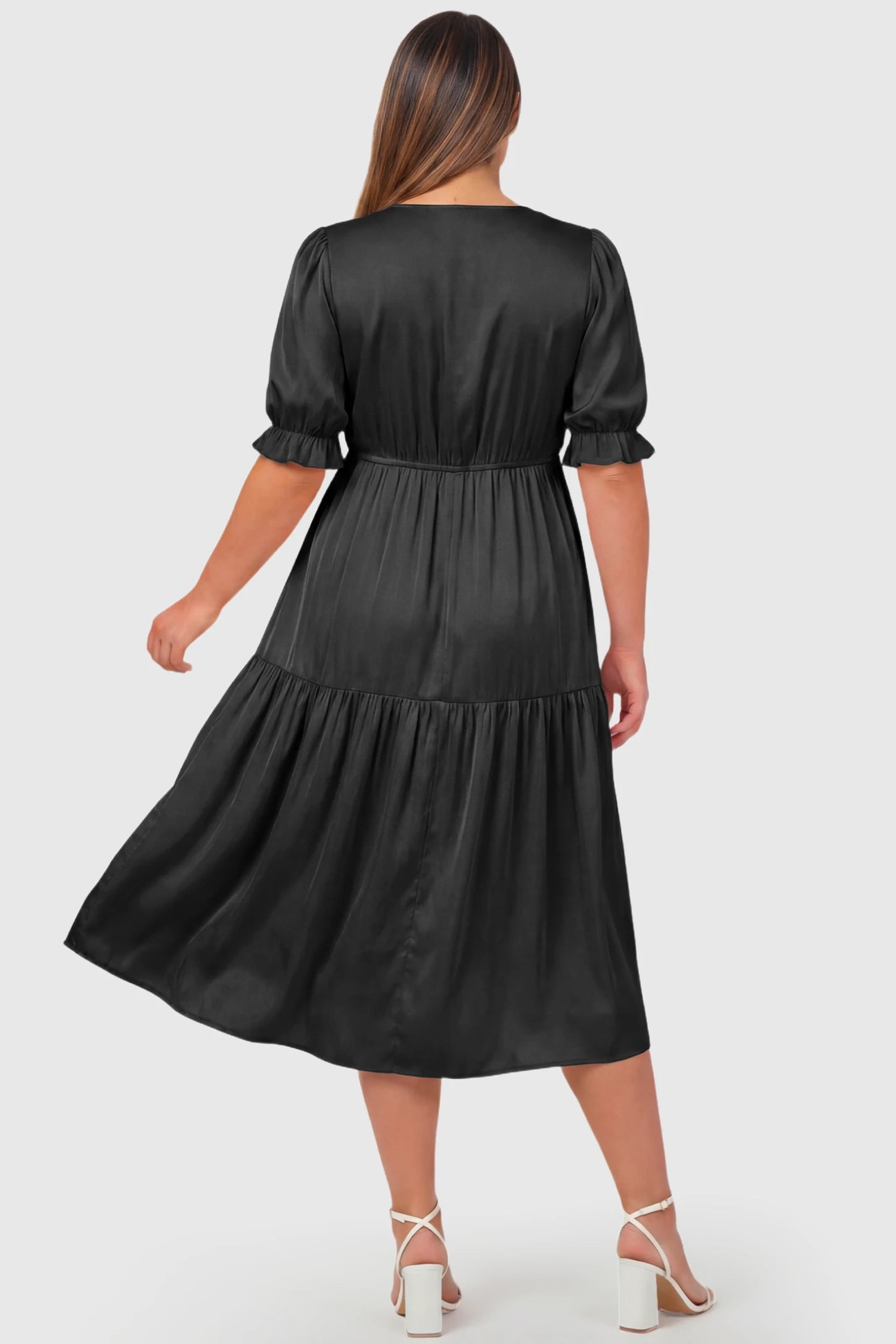 Tiered Hem A-Line Maternity Midi Dress Tiered Hem A-Line Maternity Midi Dress in apricot featuring empire waist, elbow-length puff sleeves, and flowy skirt on pregnant model.