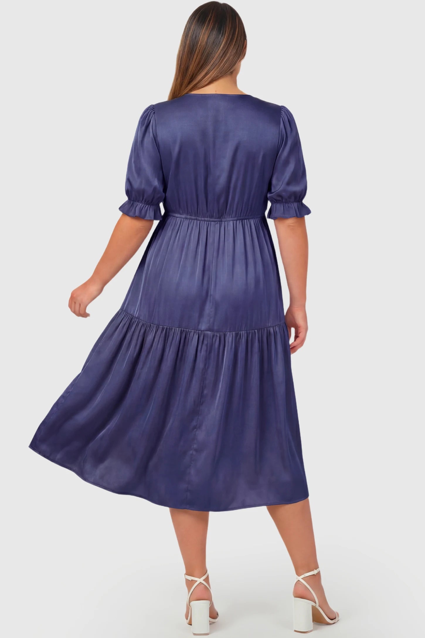 Tiered Hem A-Line Maternity Midi Dress Tiered Hem A-Line Maternity Midi Dress in navy blue featuring empire waist, elbow-length puff sleeves, and flowy skirt on pregnant model.