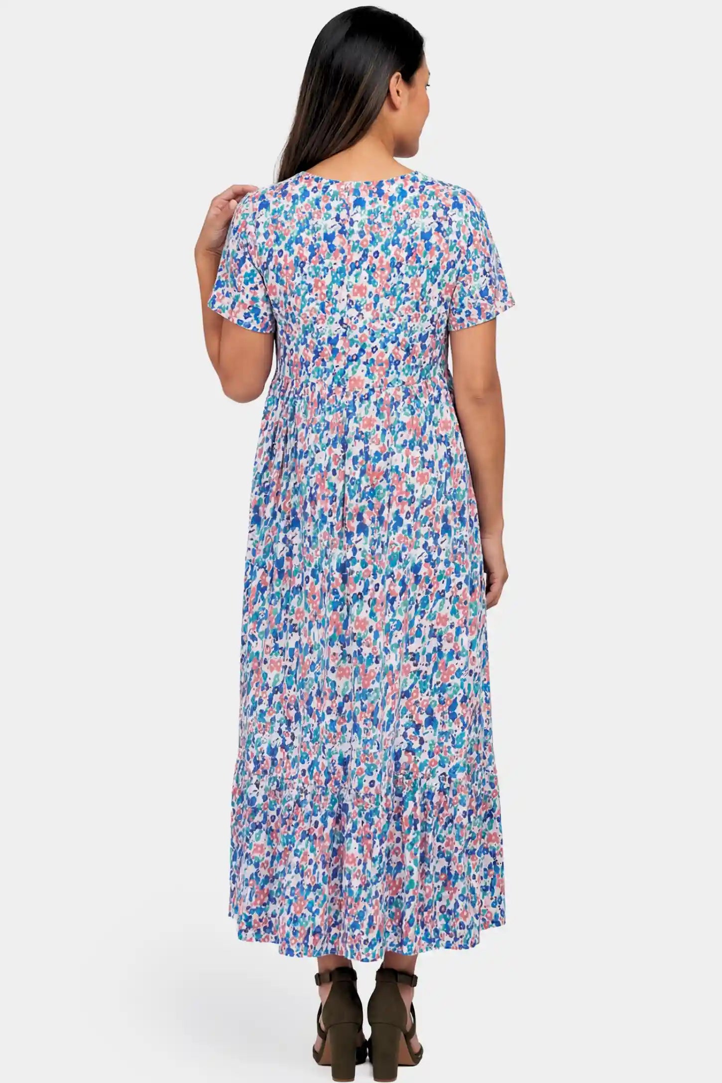 Floral A-Line Maternity Maxi Dress Floral A-Line Maternity Maxi Dress in floral blue print featuring empire waist and tiered hem a pregnant model.