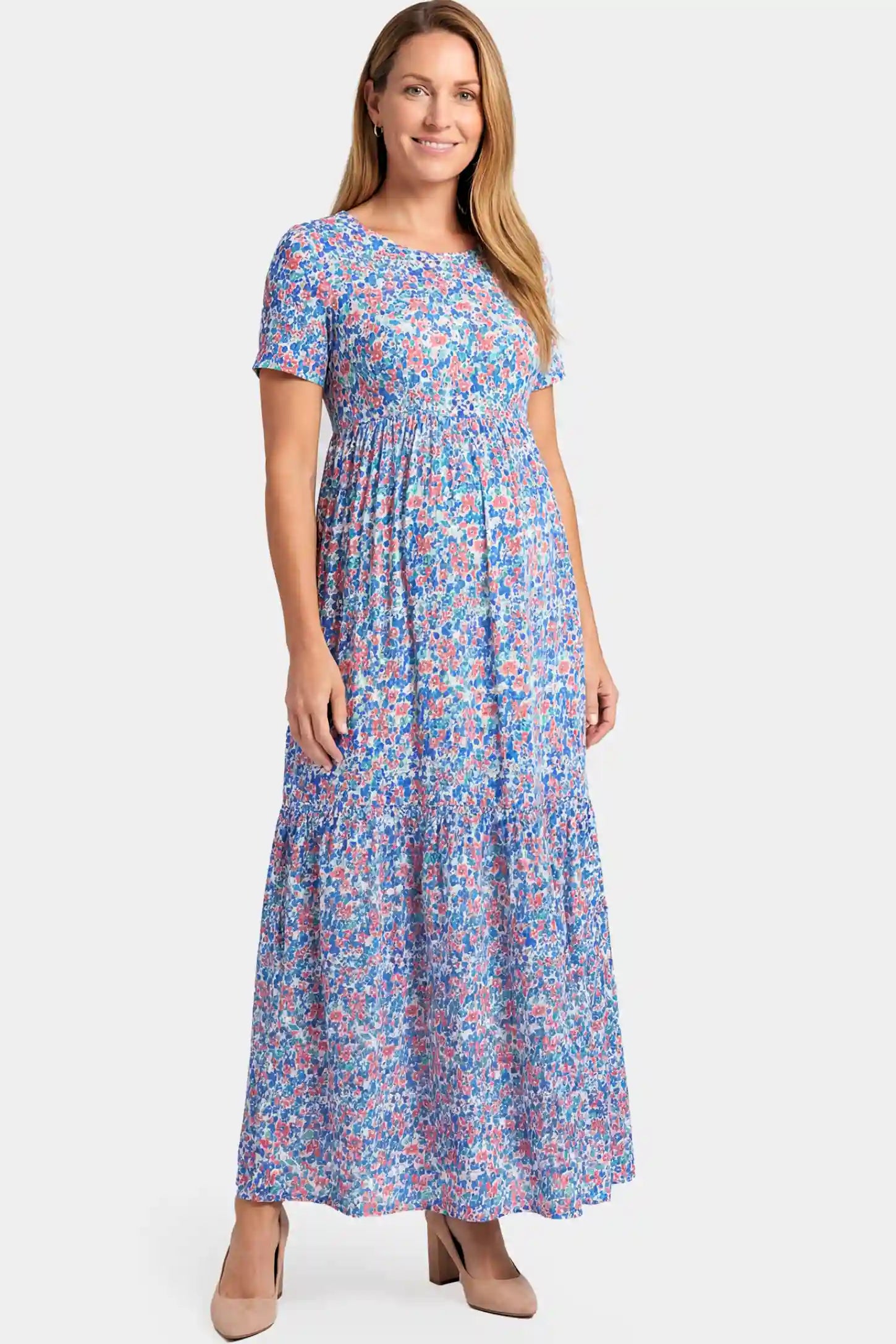 Floral A-Line Maternity Maxi Dress Floral A-Line Maternity Maxi Dress in floral blue print featuring empire waist and tiered hem a non pregnant model.