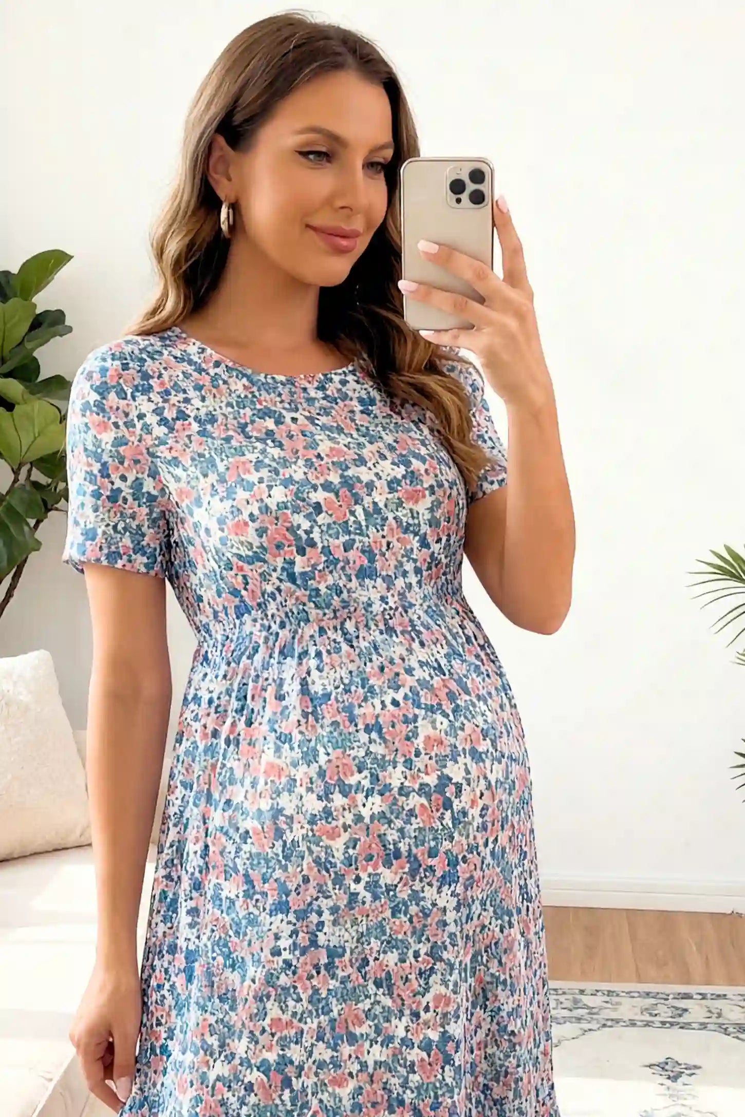 Floral A-Line Maternity Maxi Dress Floral A-Line Maternity Maxi Dress in floral blue print featuring empire waist and tiered hem a pregnant model.
