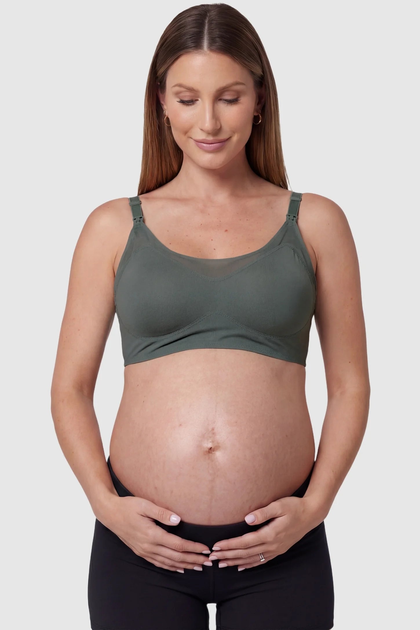Top-Open One-Handed Nursing Ice Silk Seamless Nursing Bra Top-Open One-Handed Ice Silk Nursing Bra in Green featuring stretchy, cooling fabric on a pregnant model, front view.