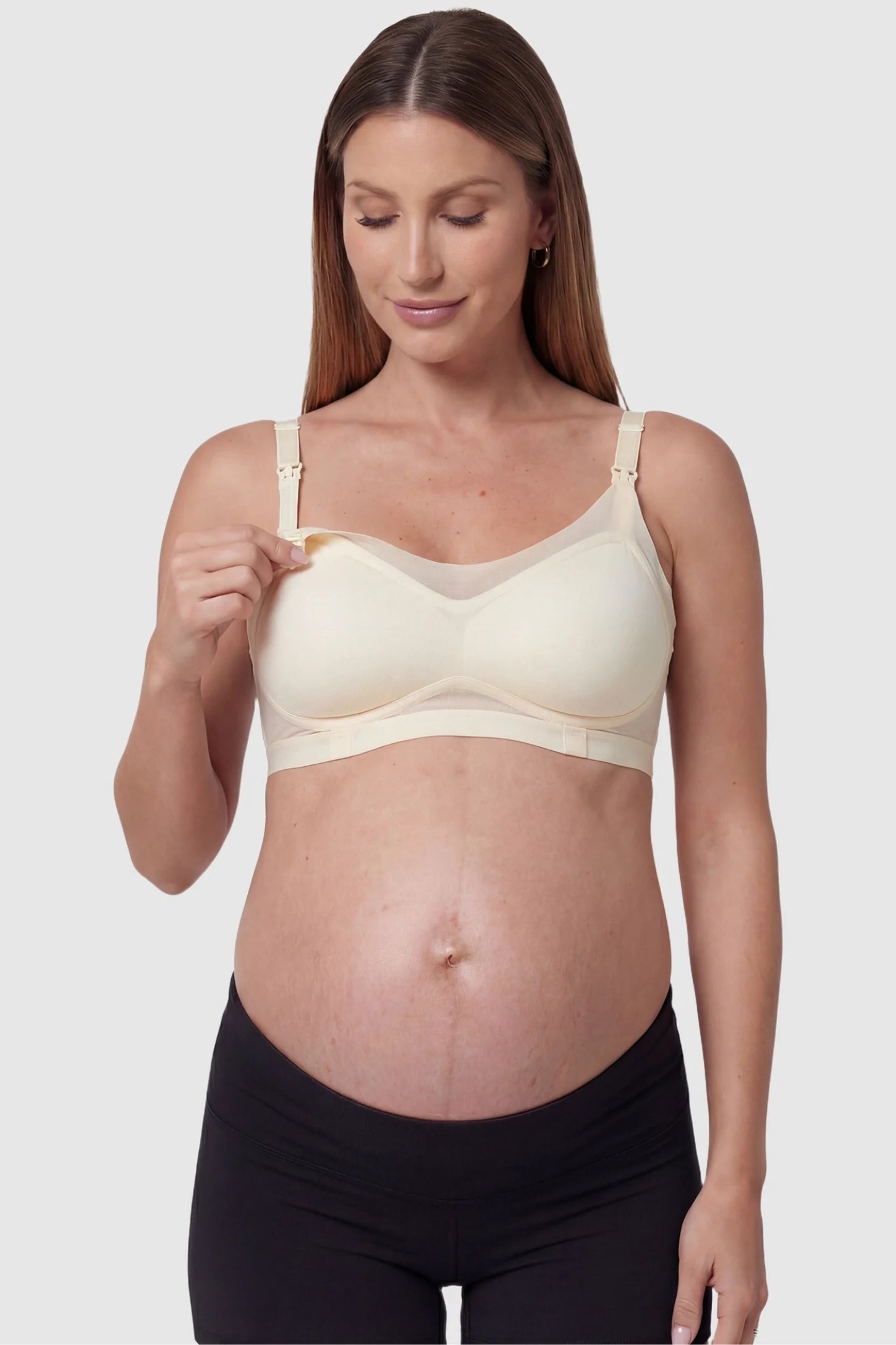 Top-Open One-Handed Nursing Ice Silk Seamless Nursing Bra Skin Tone Ice Silk Nursing Bra featuring quick-release clips for nursing access on a pregnant model, functional detail image.