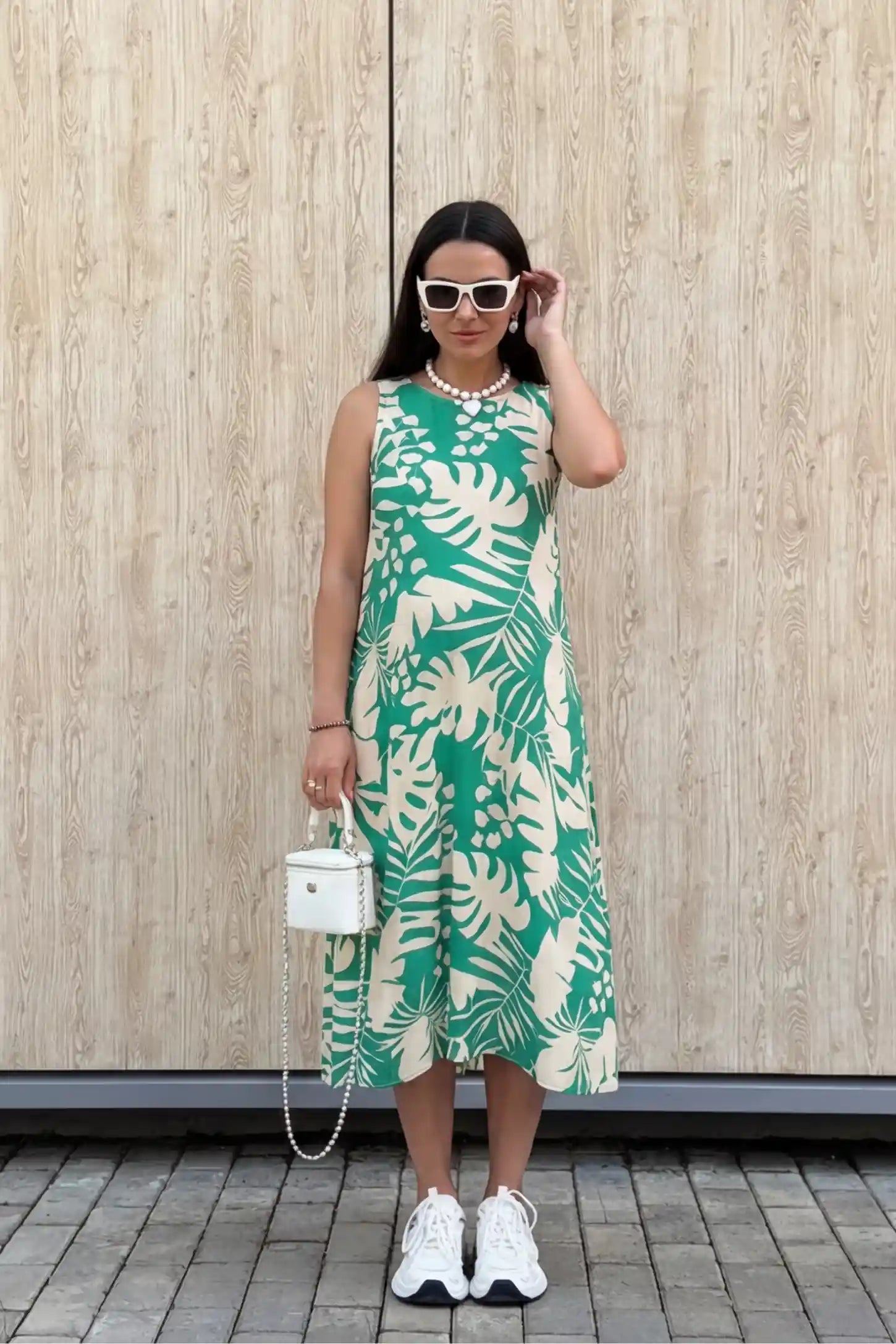 Tropical Print V-Back Sleeveless Midi Maternity Dress Green Tropical Print V-Back Sleeveless Midi Maternity Dress front view featuring a bold leaf pattern on a pregnant model.