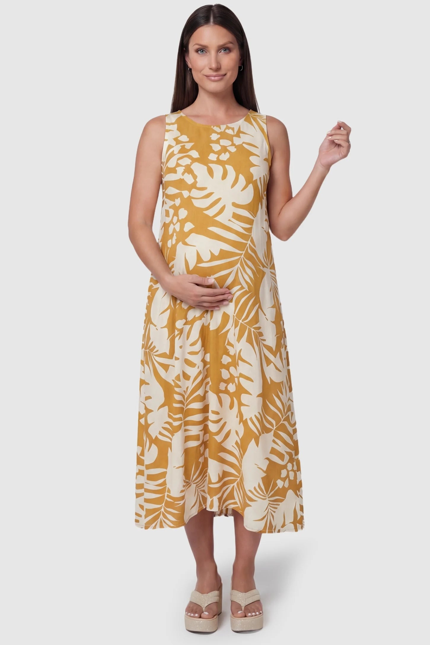 Tropical Print V-Back Sleeveless Midi Maternity Dress Orange Tropical Print V-Back Sleeveless Midi Maternity Dress front view featuring a round neckline on a pregnant model.