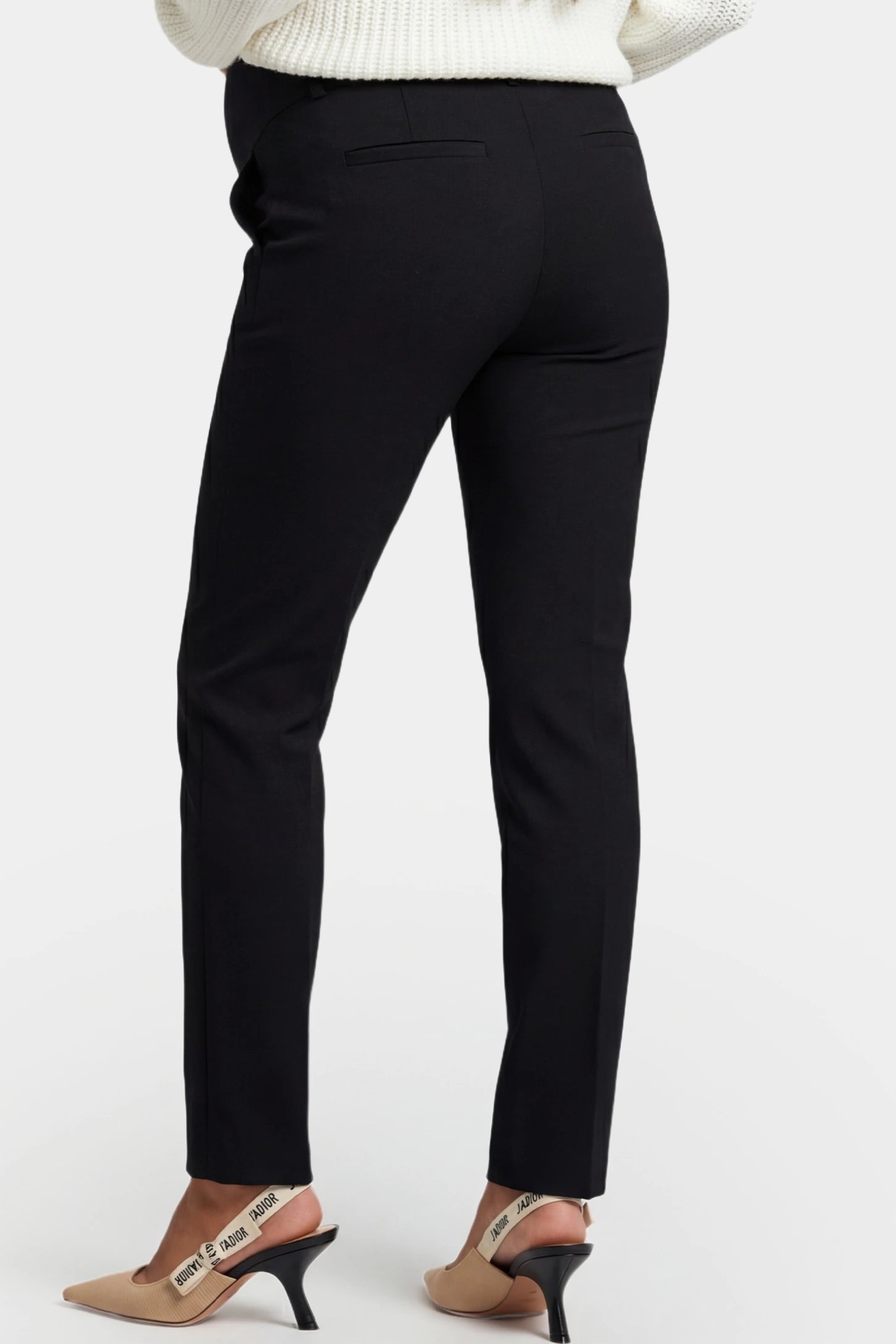 High-Waist Belly Support Slim-Fit Cigarette Maternity Pants High-waist slim-fit cigarette maternity pants in black with functional back pockets, back view on pregnant model
