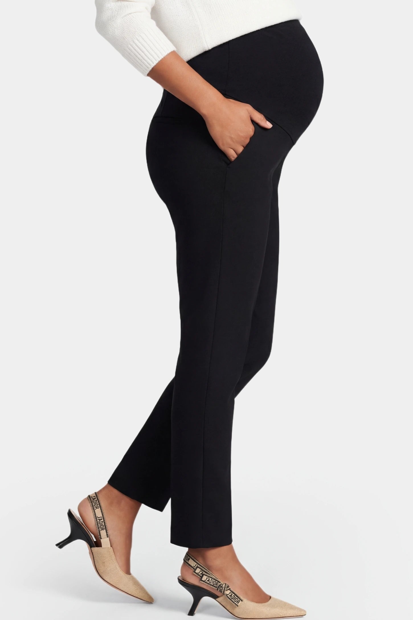 High-Waist Belly Support Slim-Fit Cigarette Maternity Pants High-waist slim-fit cigarette maternity pants in black with stretchable waistband, side view on pregnant model