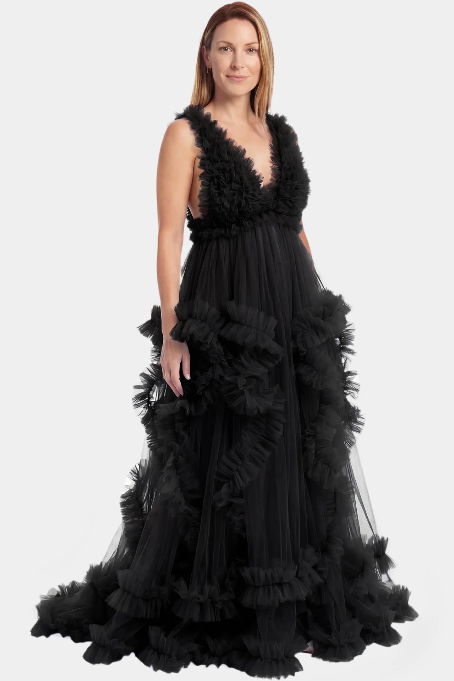 Multi-Layered Tulle Deep V-Neck Sleeveless Maxi Maternity Gown Multi-layered tulle deep V-neck sleeveless maxi maternity gown in black featuring flowing pleated silhouette in full body front view on a postpartum model