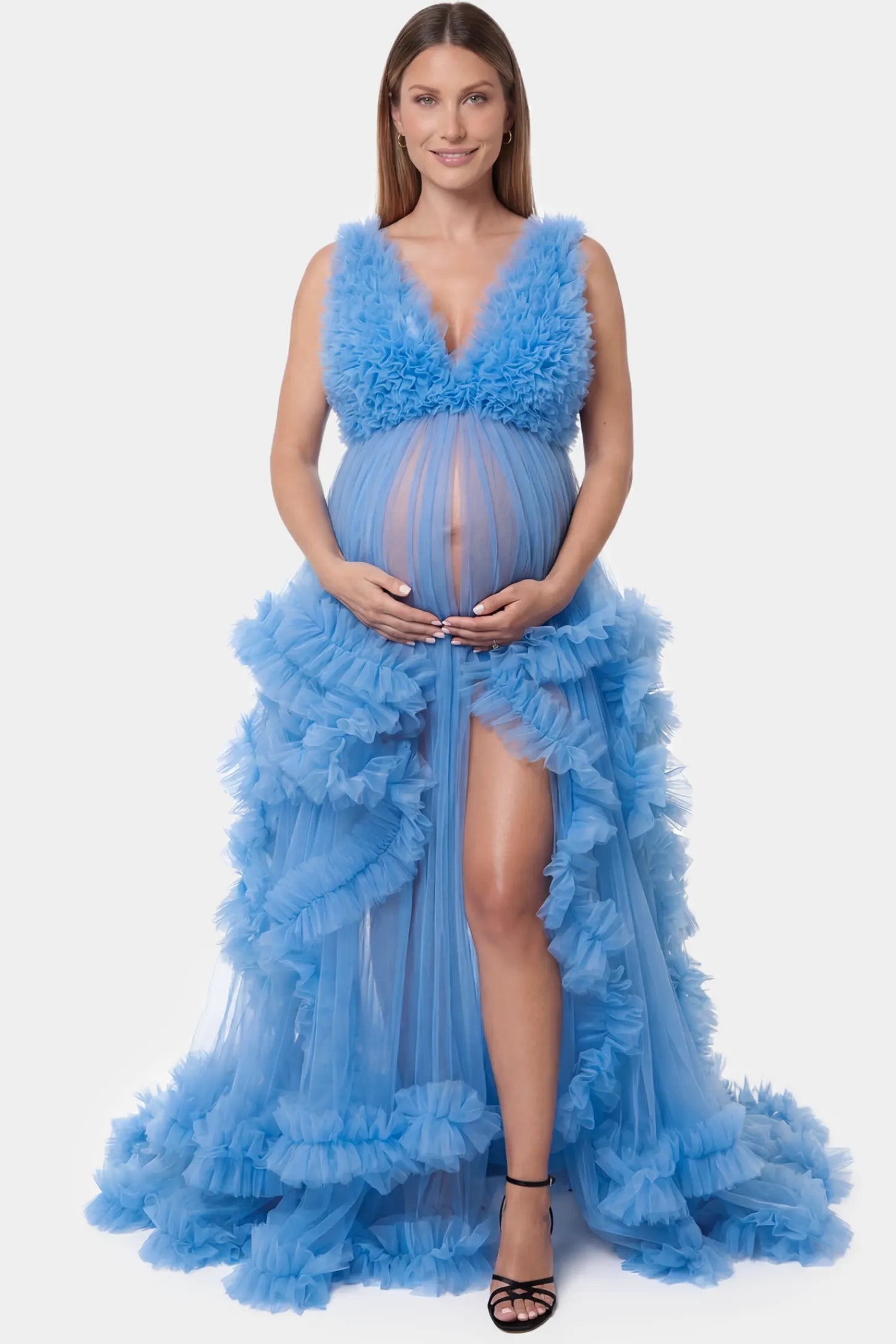 Multi-Layered Tulle Deep V-Neck Sleeveless Maxi Maternity Gown Multi-layered tulle deep V-neck sleeveless maxi maternity gown in blue featuring flowing pleated silhouette in full body front view on a pregnant model