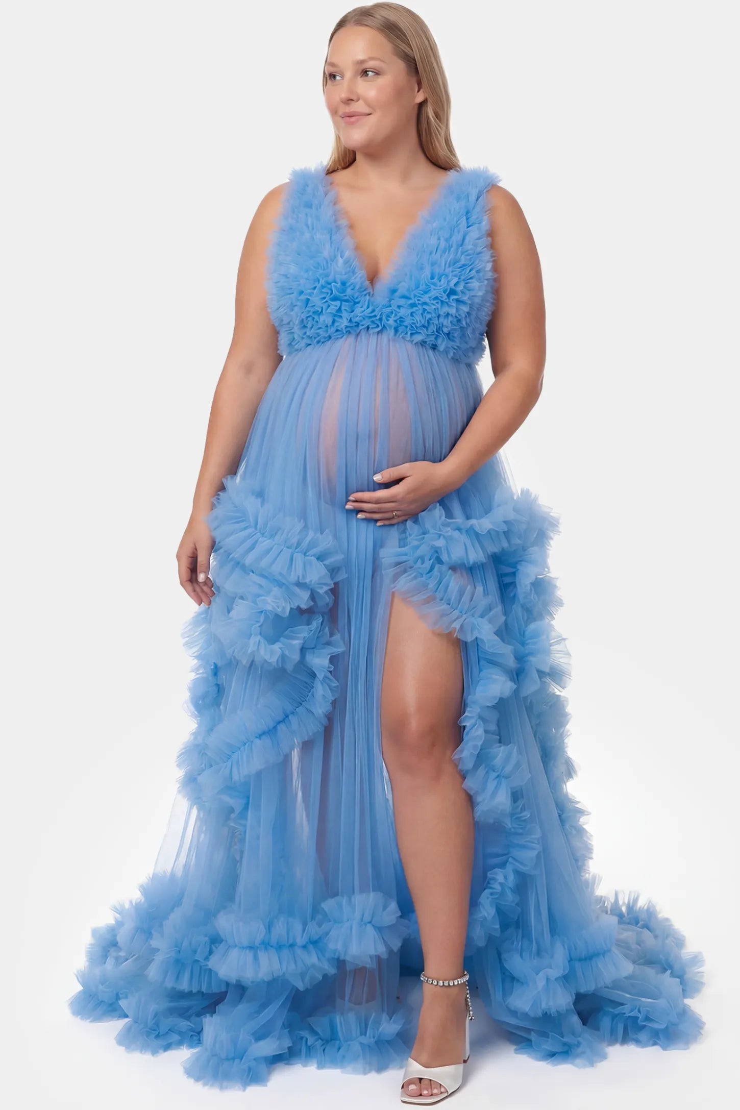 Multi-Layered Tulle Deep V-Neck Sleeveless Maxi Maternity Gown Multi-layered tulle deep V-neck sleeveless maxi maternity gown in blue featuring flowing pleated silhouette in full body front view on a plus-size model