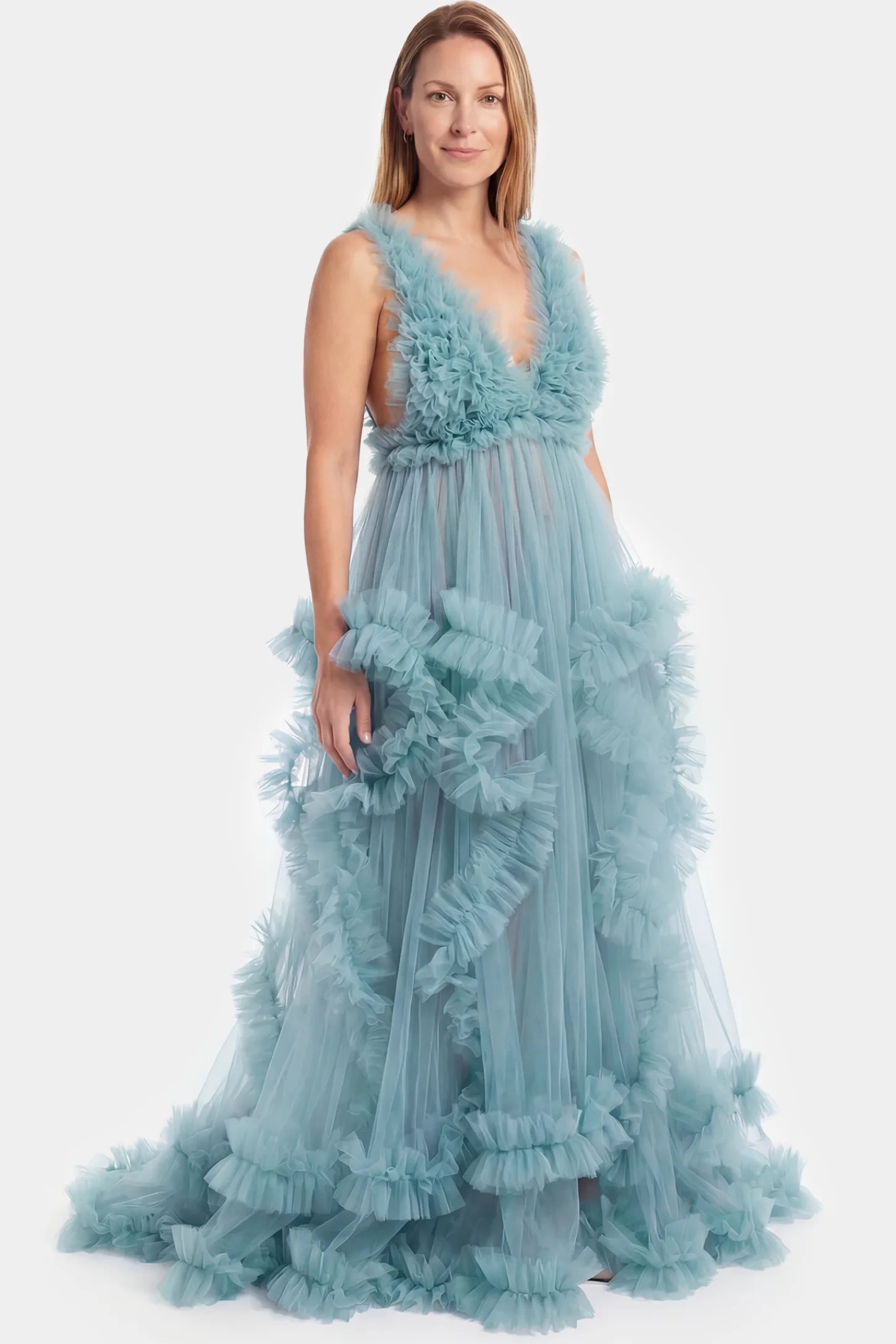 Multi-Layered Tulle Deep V-Neck Sleeveless Maxi Maternity Gown Multi-layered tulle deep V-neck sleeveless maxi maternity gown in lake blue featuring flowing pleated silhouette in full body front view on a postpartum model