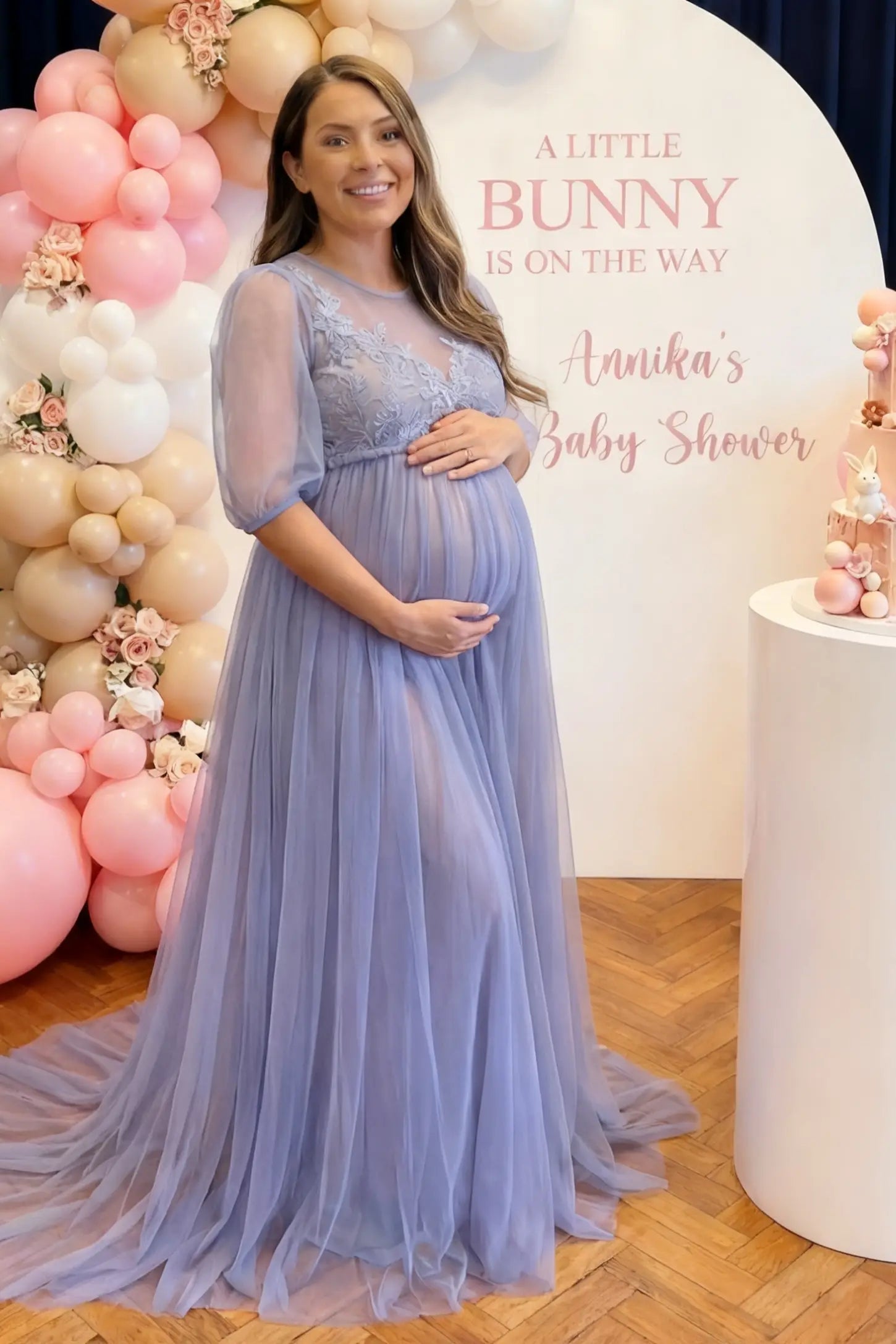 Tulle-Lace V-Neck Short Sleeve Trailing Maxi Maternity Dress Tulle-lace V-neck short sleeve trailing maxi maternity dress in light blue with layered tulle skirt, full body on editorial lifestyle model