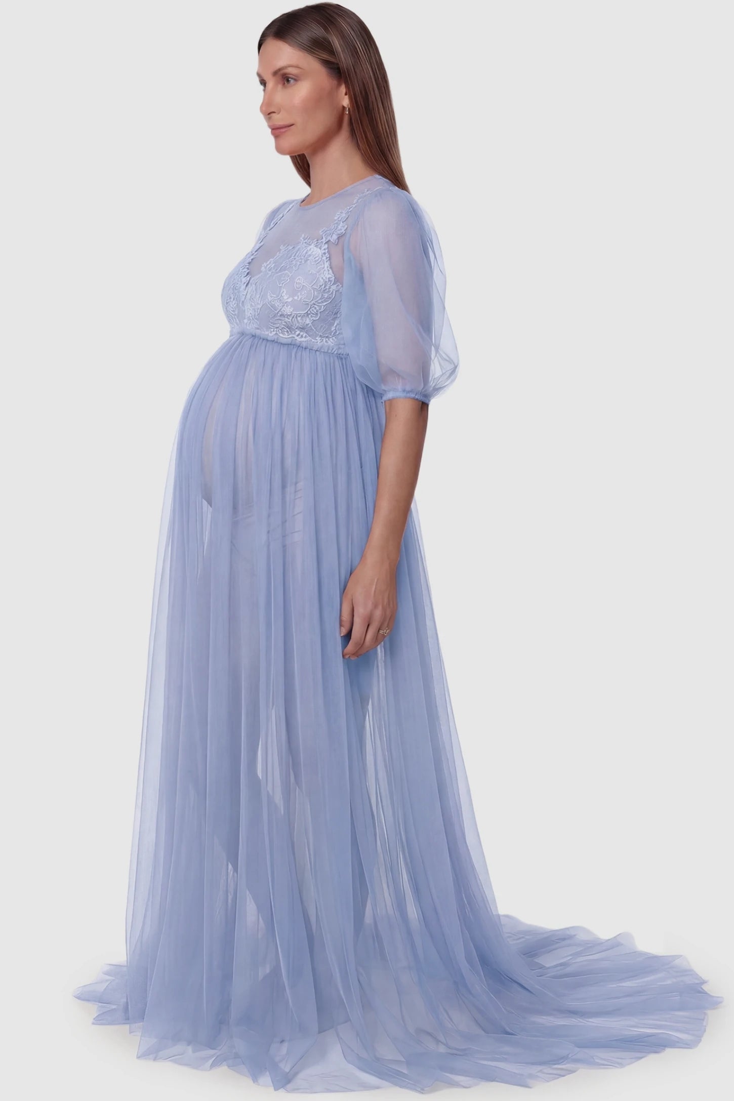 Tulle-Lace V-Neck Short Sleeve Trailing Maxi Maternity Dress Tulle-lace V-neck short sleeve trailing maxi maternity dress in light blue featuring flowing layered tulle skirt in side view on a pregnant model