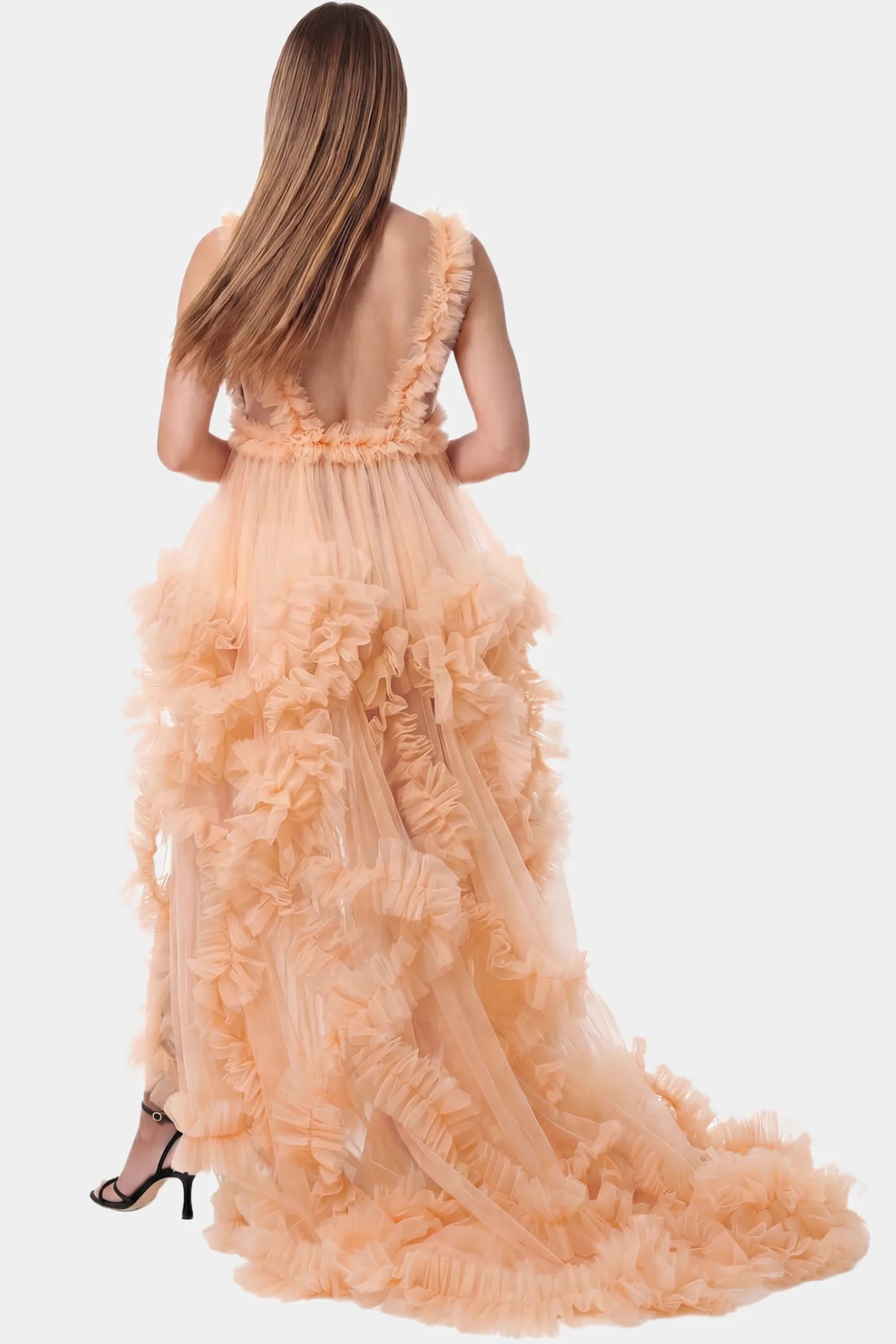 Multi-Layered Tulle Deep V-Neck Sleeveless Maxi Maternity Gown Multi-layered tulle deep V-neck sleeveless maxi maternity gown in mustard yellow featuring an open back in full body front view on a pregnant model