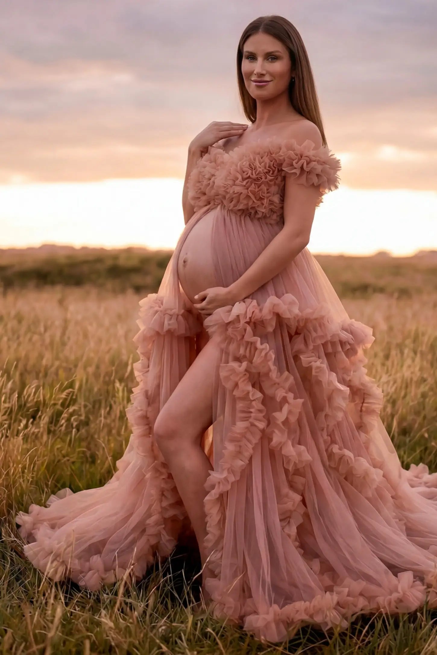Ruffled Tulle Convertible Neckline Maternity Photoshoot Gown Ruffled tulle convertible neckline maternity photoshoot gown in pink with open front and ruffled tulle layers, side view on pregnant model