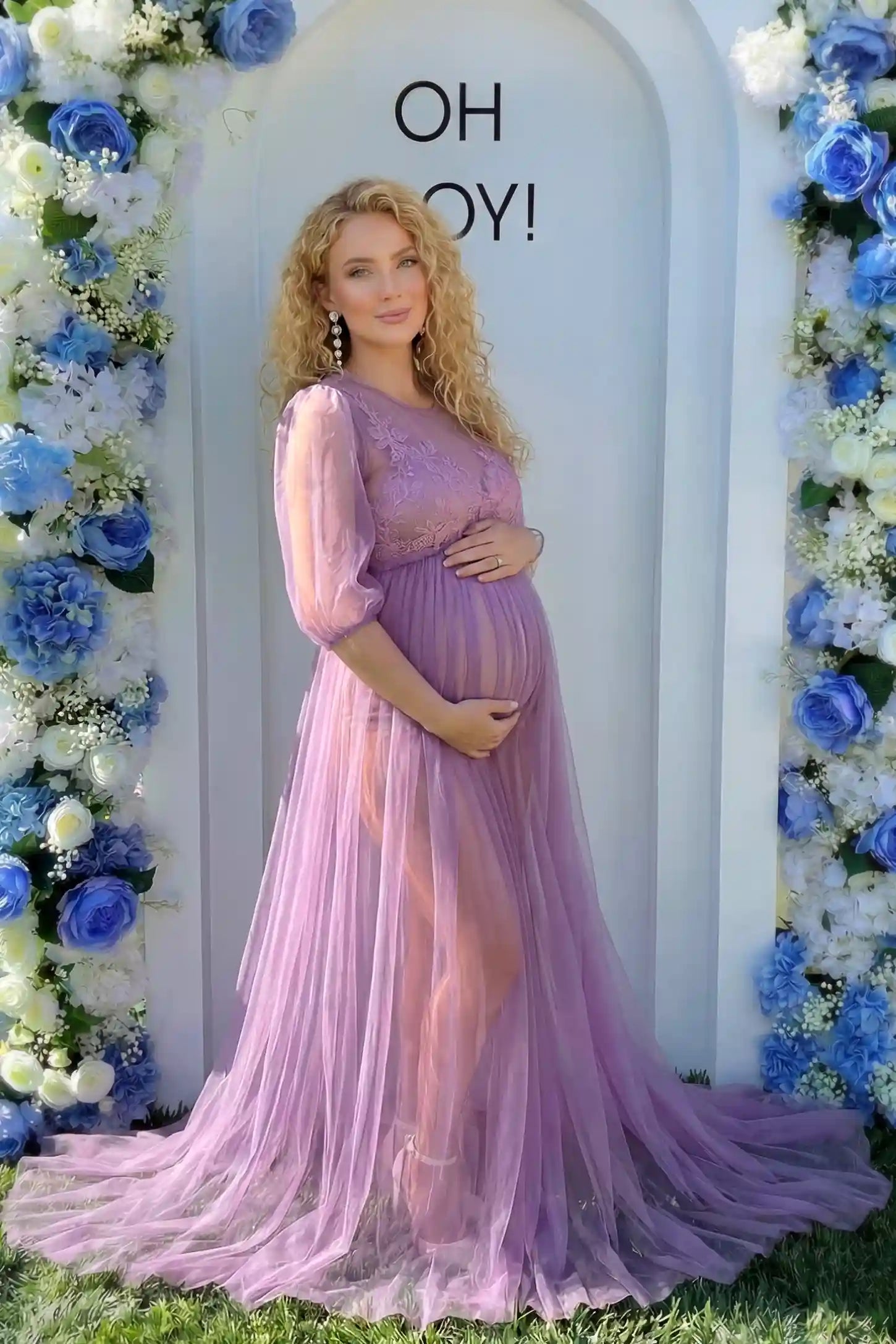 Tulle-Lace V-Neck Short Sleeve Trailing Maxi Maternity Dress Tulle-lace V-neck short sleeve trailing maxi maternity dress in violet with layered tulle skirt, full body on editorial lifestyle model