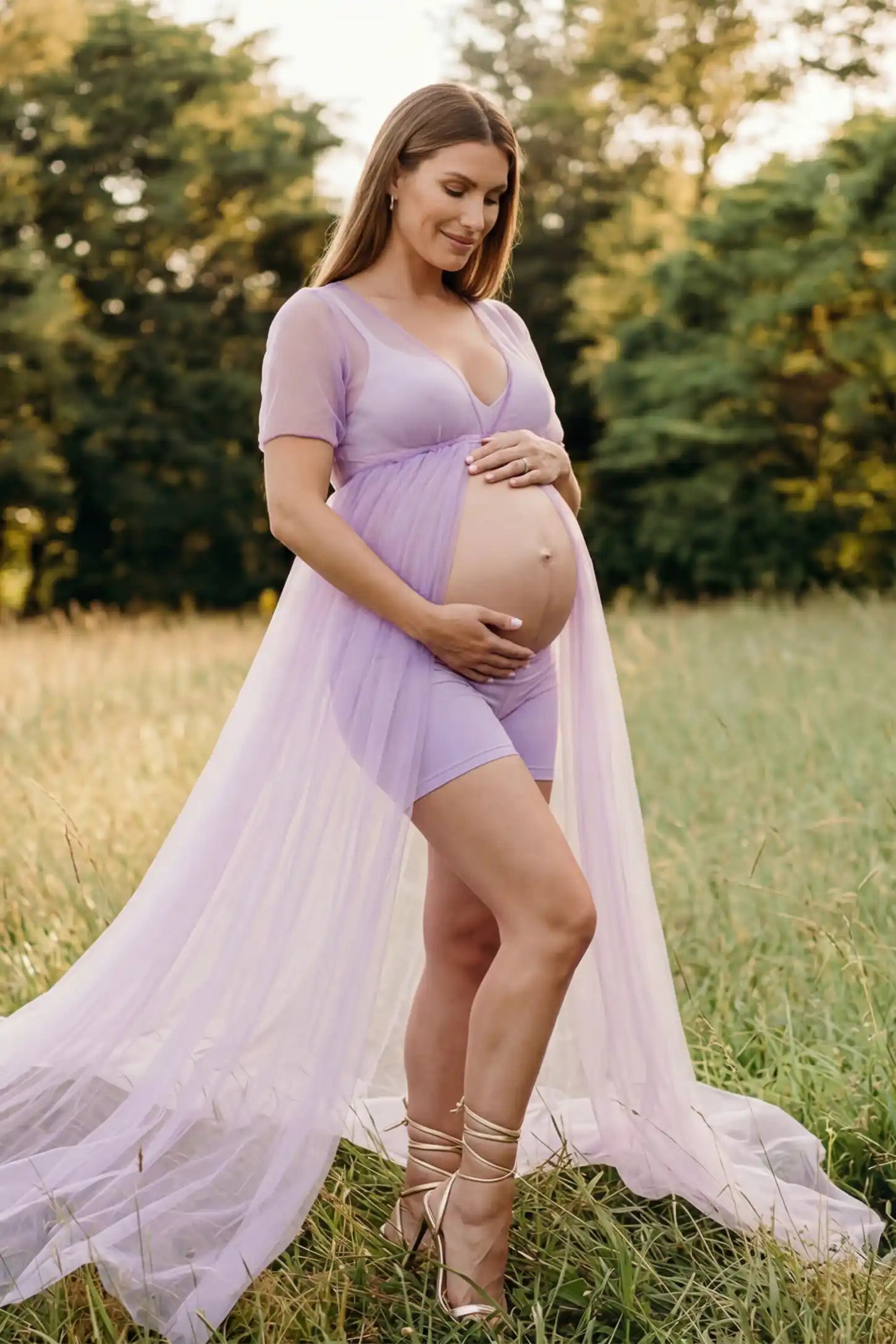 Tulle-Lace Sheer Half Sleeve Maternity Photoshoot Gown Tulle-lace sheer half sleeve maternity gown in violet with delicate lace-spliced detail and high front slit, front view on pregnant model
