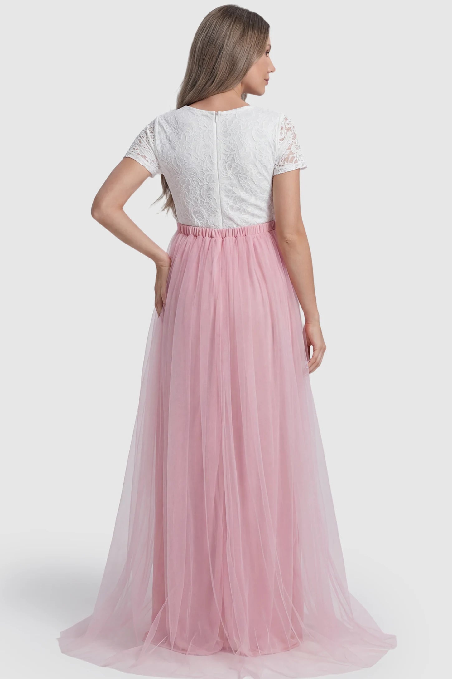 Lace & Tulle Short Sleeve Maternity Gown Lace & Tulle Short Sleeve Maternity Gown in pink featuring lace bodice, empire waist, and flowing tulle train on pregnant model.