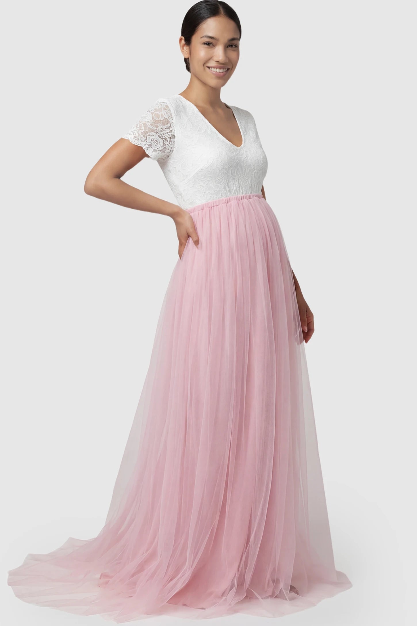 Lace & Tulle Short Sleeve Maternity Gown Lace & Tulle Short Sleeve Maternity Gown in pink featuring V-neck lace bodice, empire waist, and flowing tulle train on non pregnant model.
