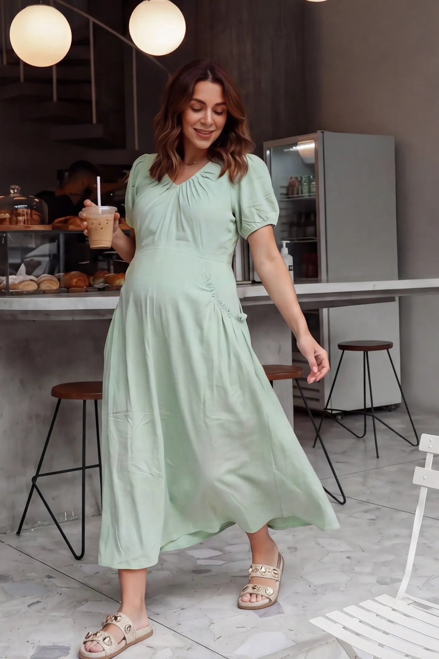 V-Neck Short Sleeve Maternity Midi Dress with Pockets V-neck short sleeve maternity midi dress with pockets in green with short sleeves, front view on pregnant model